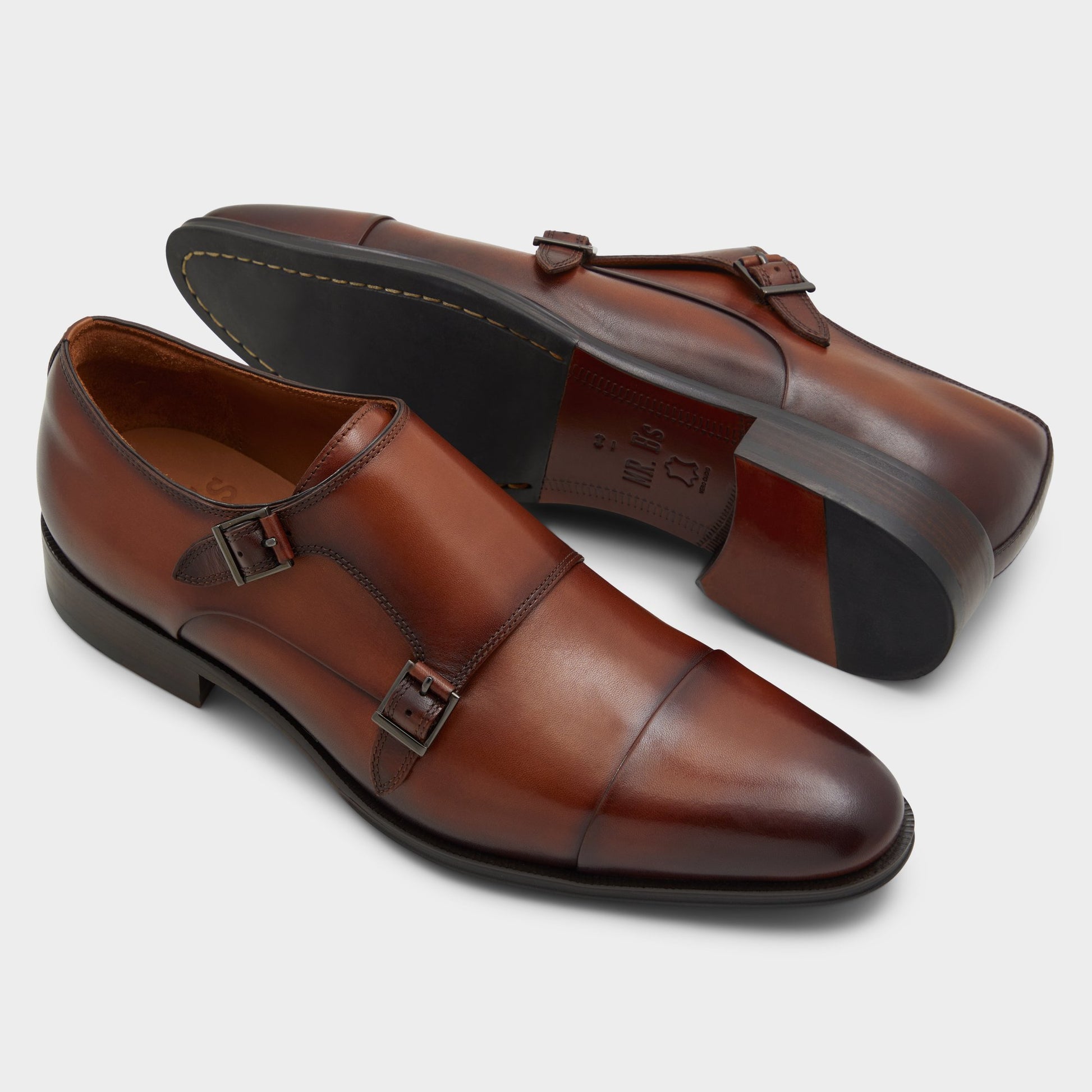 Highlighted view of a pair of Cognac Axwell Monkstrap loafers