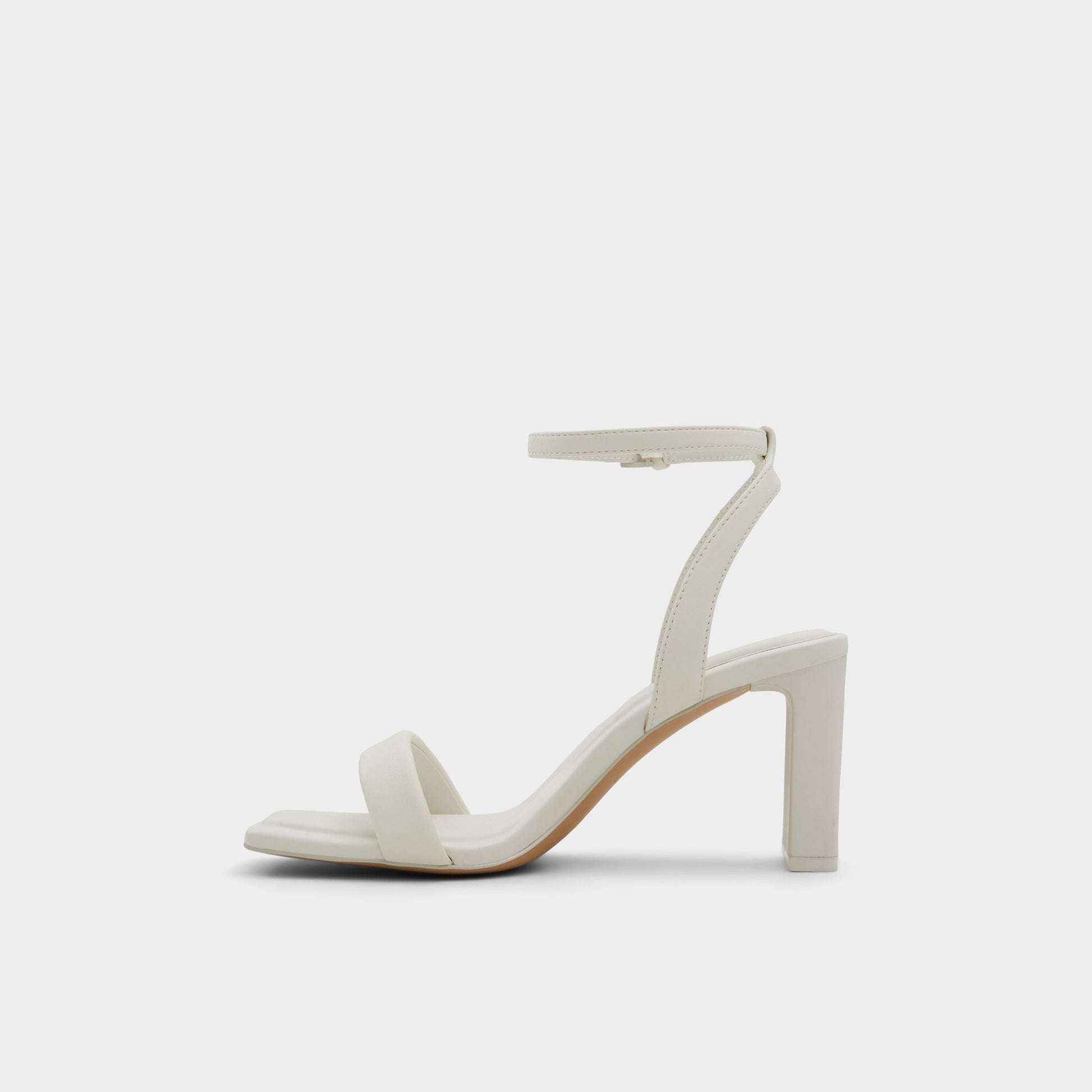 Side view of White/Bone Aurorai Strappy heeled sandal