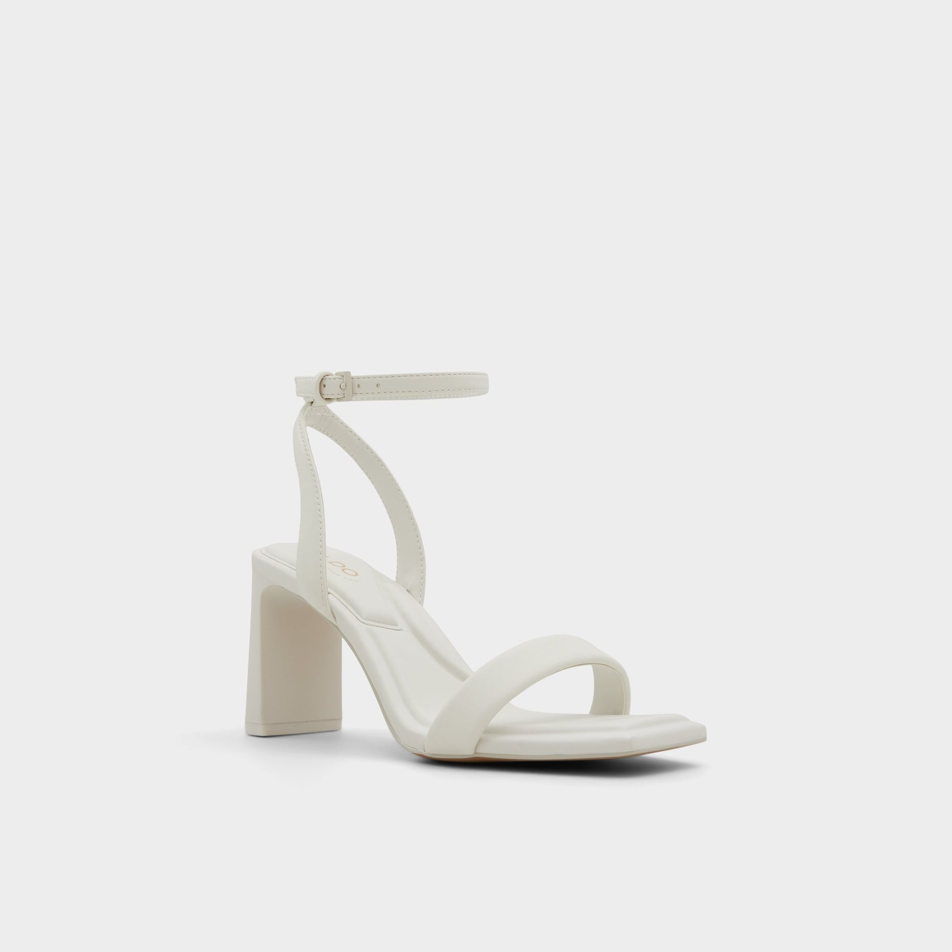 Three-quarter angle of White/Bone Aurorai Strappy heeled sandal's front side