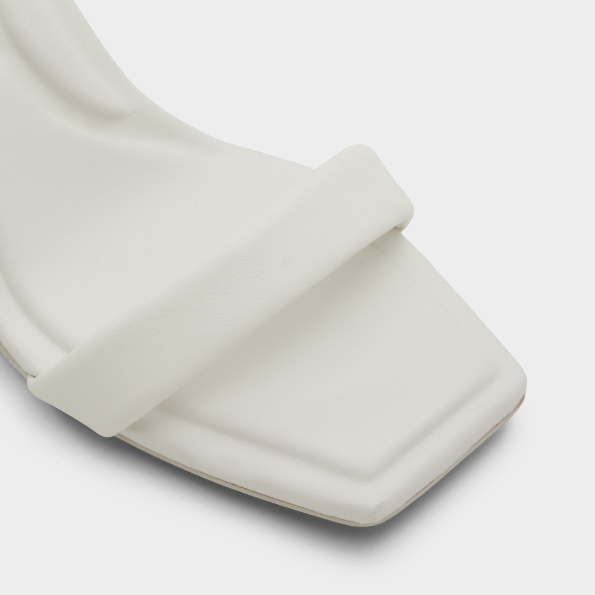 Close-up of the White/Bone Aurorai Strappy heeled sandal