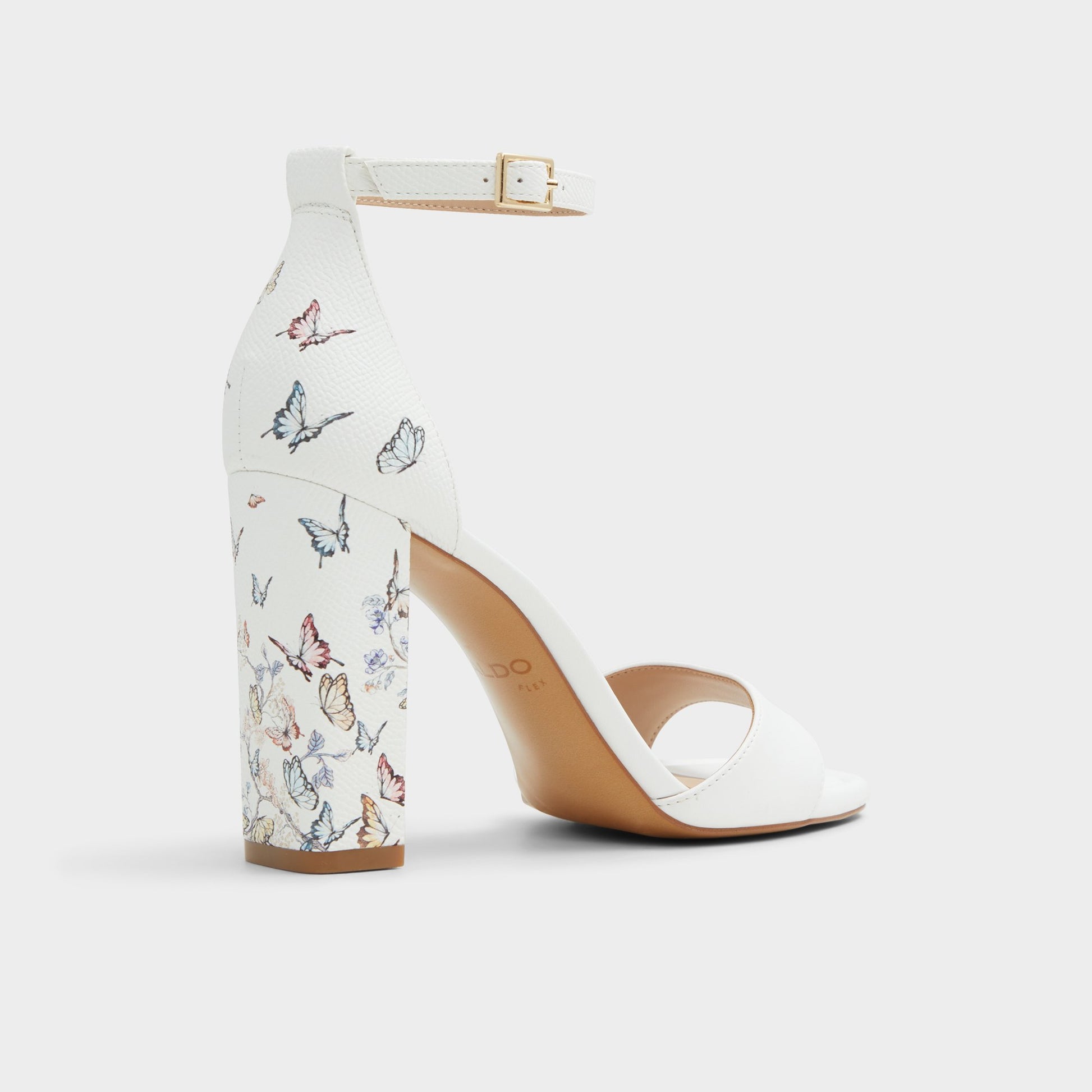 Three-quarter angle of White Multi Enaegyn Strappy heeled sandal's back side