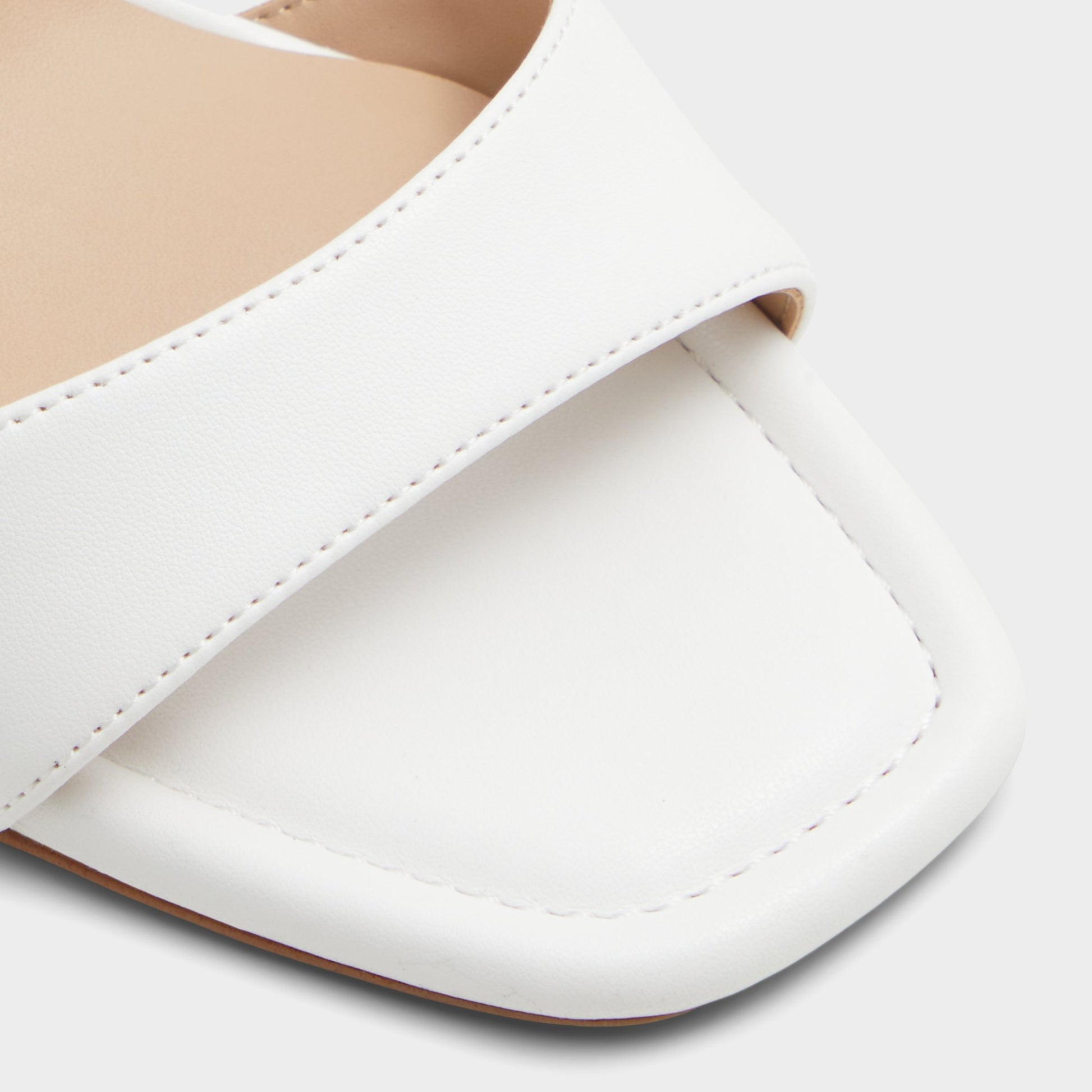 Close-up of the White Multi Enaegyn Strappy heeled sandal