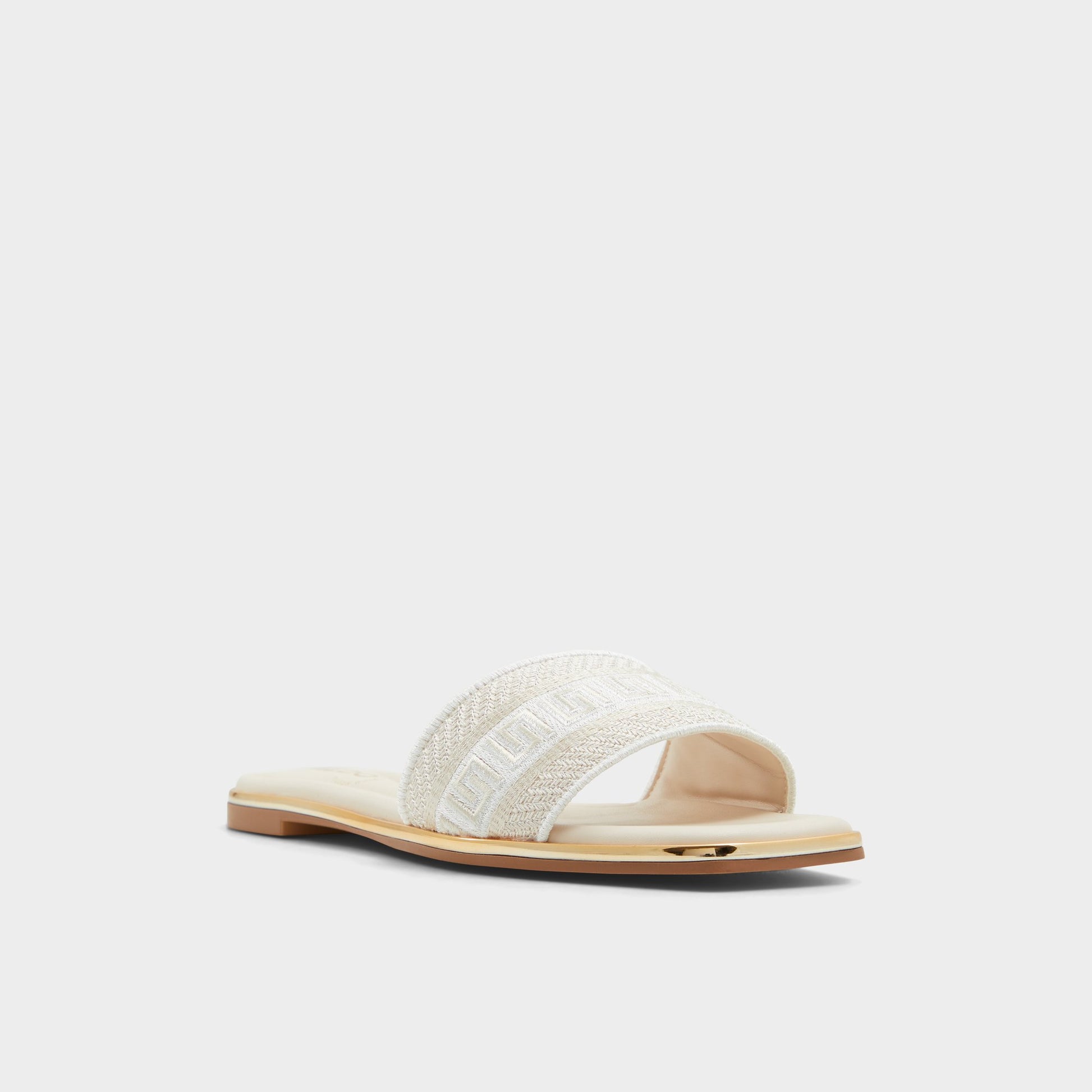 Three-quarter angle of Other beige Oceania Slide sandal's front side