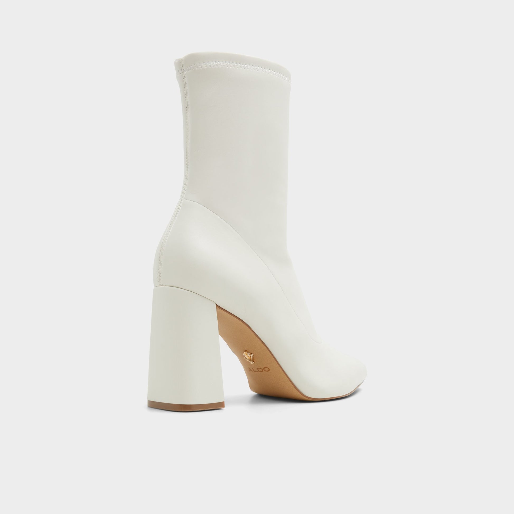 Three-quarter angle of White/Bone Figtree Ankle boot's back side