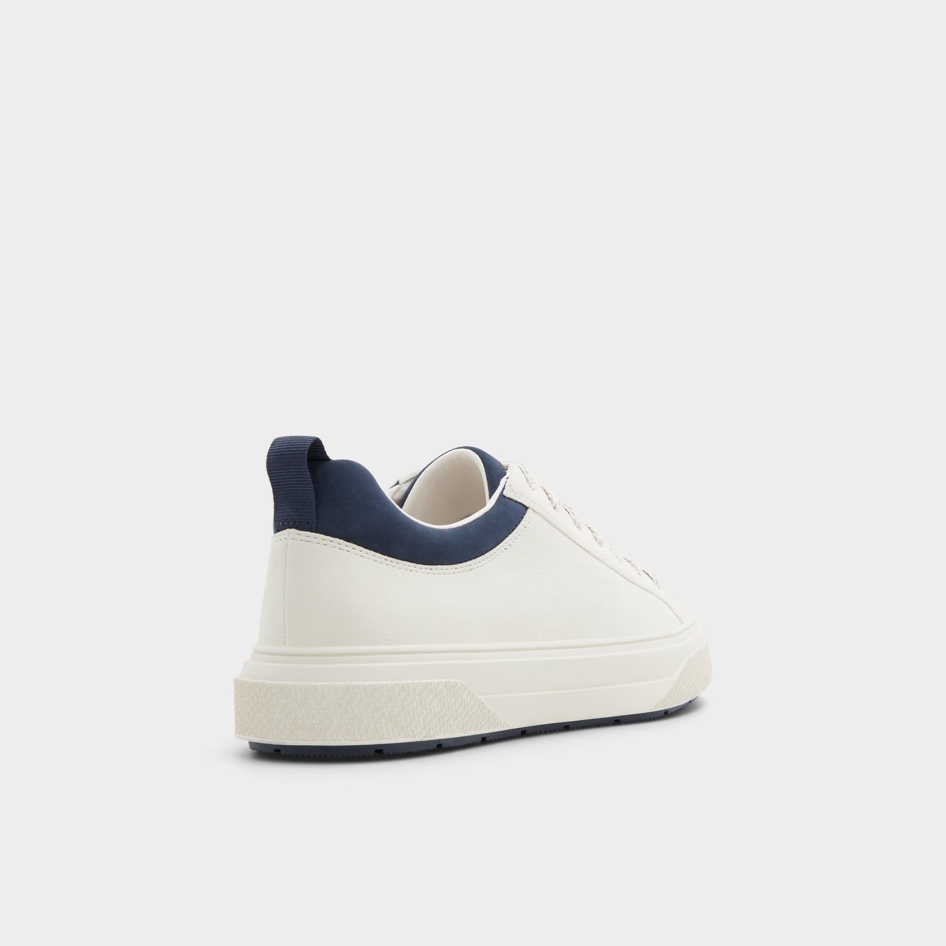 Three-quarter angle of White/Bone Bas Low top sneaker's back side