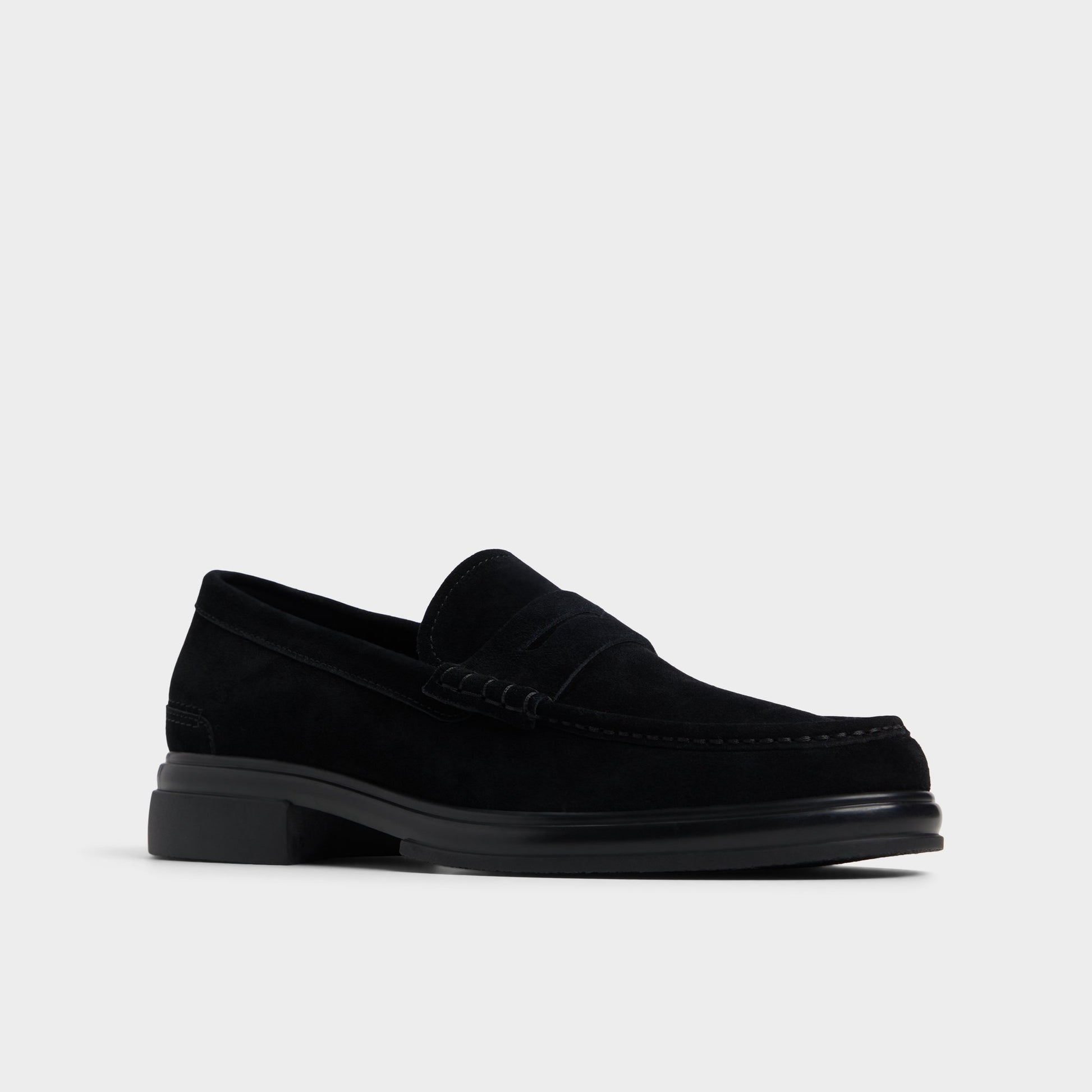 Three-quarter angle of Black/Black Tucker Loafer's front side