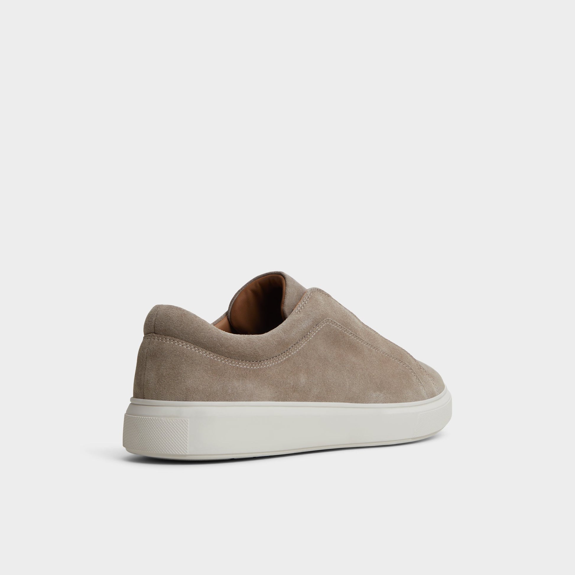 Three-quarter angle of Beige Abbott Slip-on sneaker's back side
