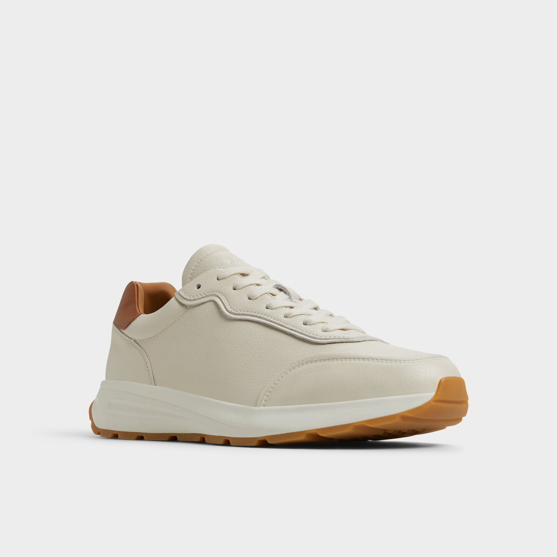 Three-quarter angle of Ivory Alessio Jogger sneaker's front side