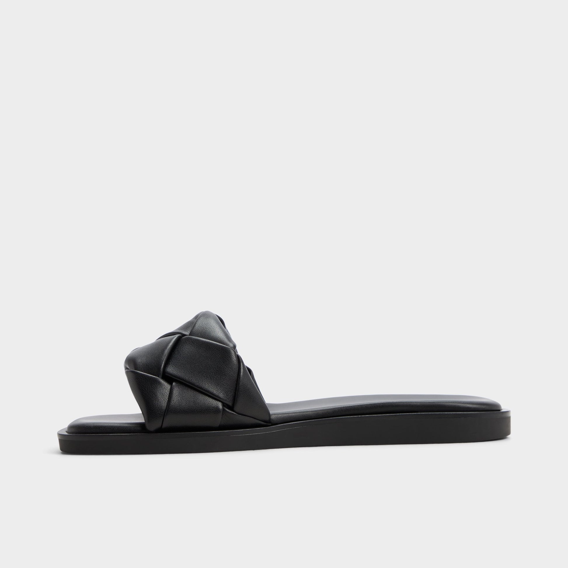 Side view of Other black Esterelle Slide sandal