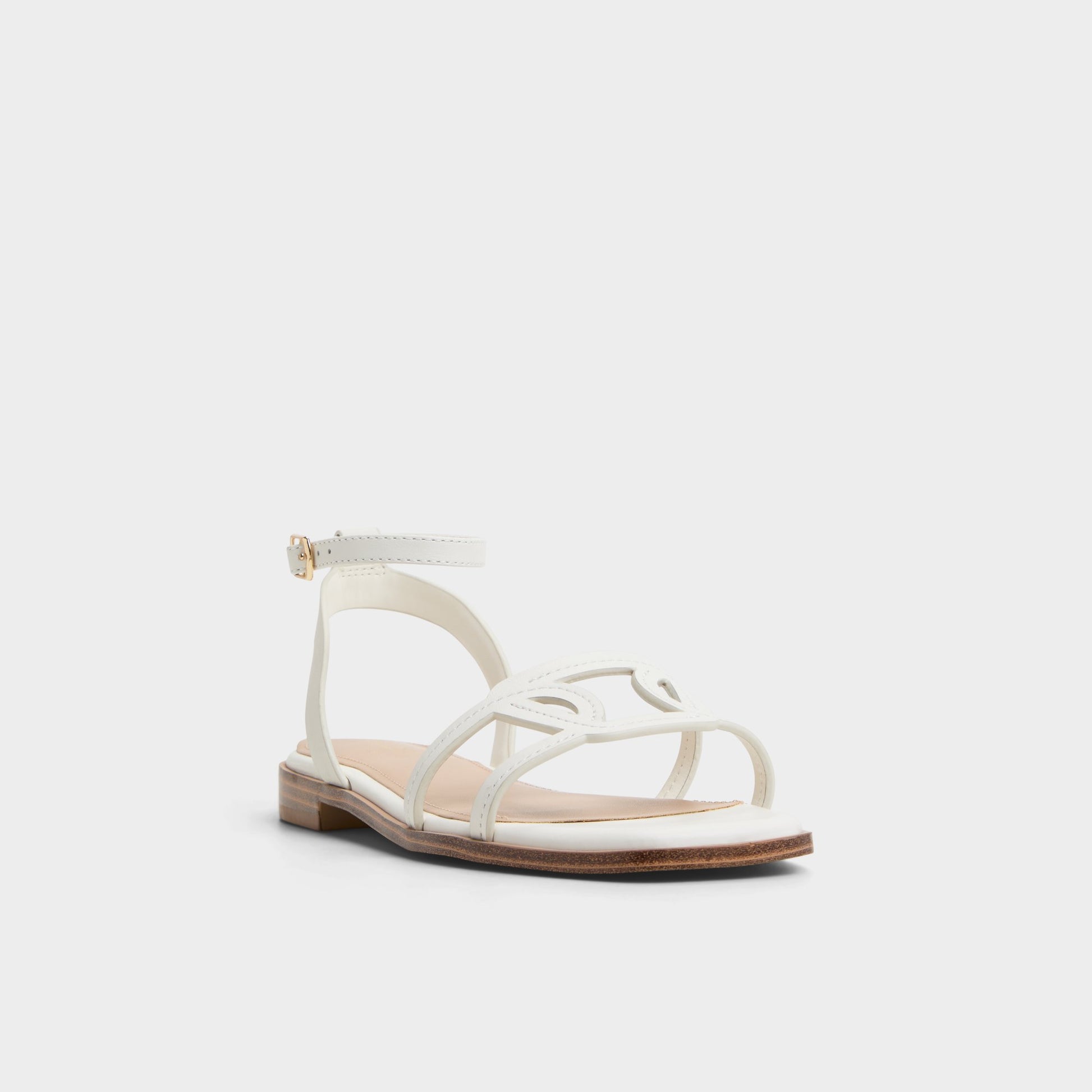 Three-quarter angle of White Greengrove Flat sandal's front side