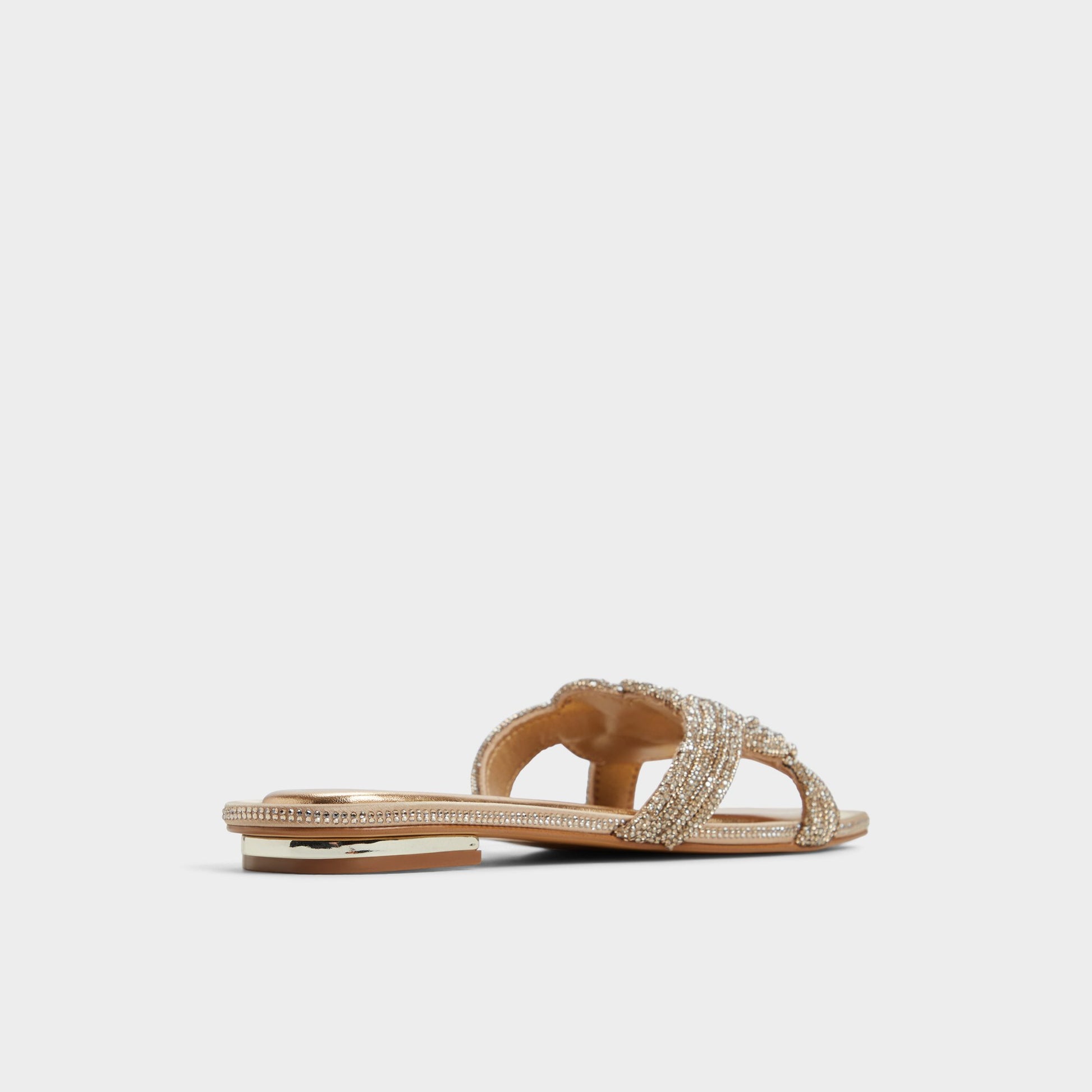 Three-quarter angle of Gold Karlina Slide sandal's back side