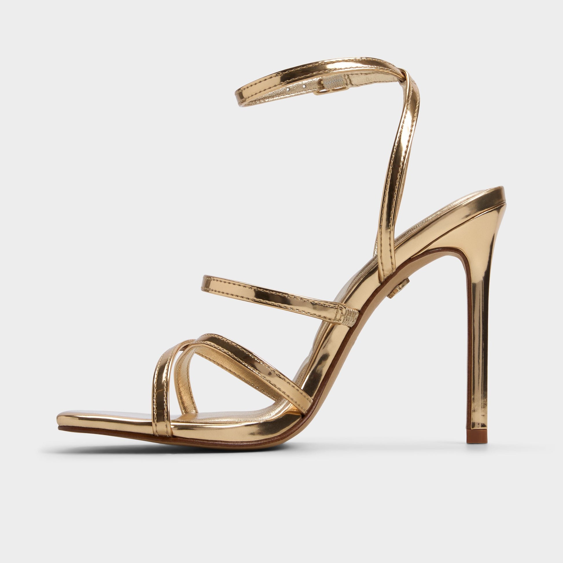 Side view of Gold Galoi Strappy heeled sandal