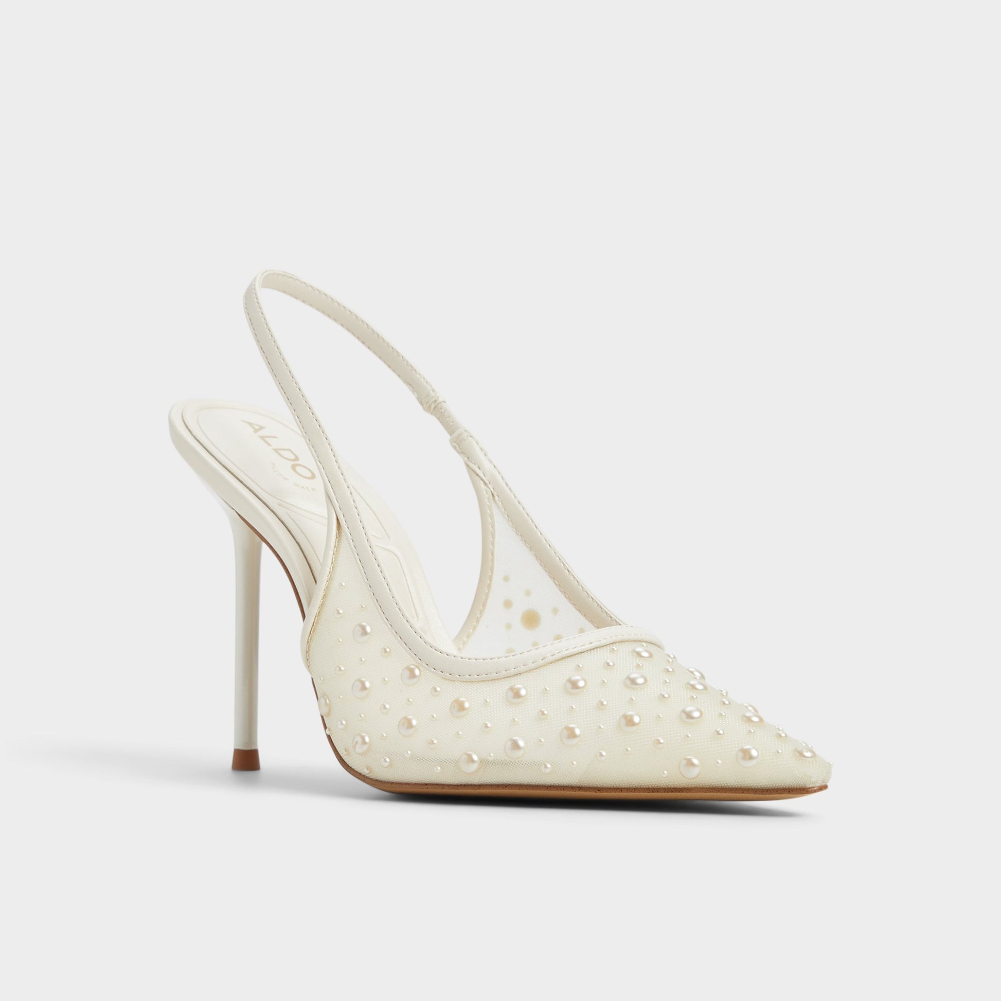 Three-quarter angle of Other White Pearlescent Slingback heel's front side