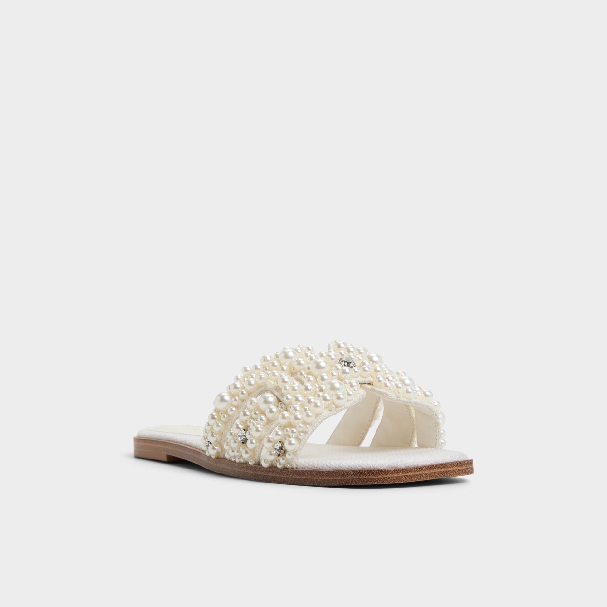 Three-quarter angle of White Multi Eleny Slide sandal's front side