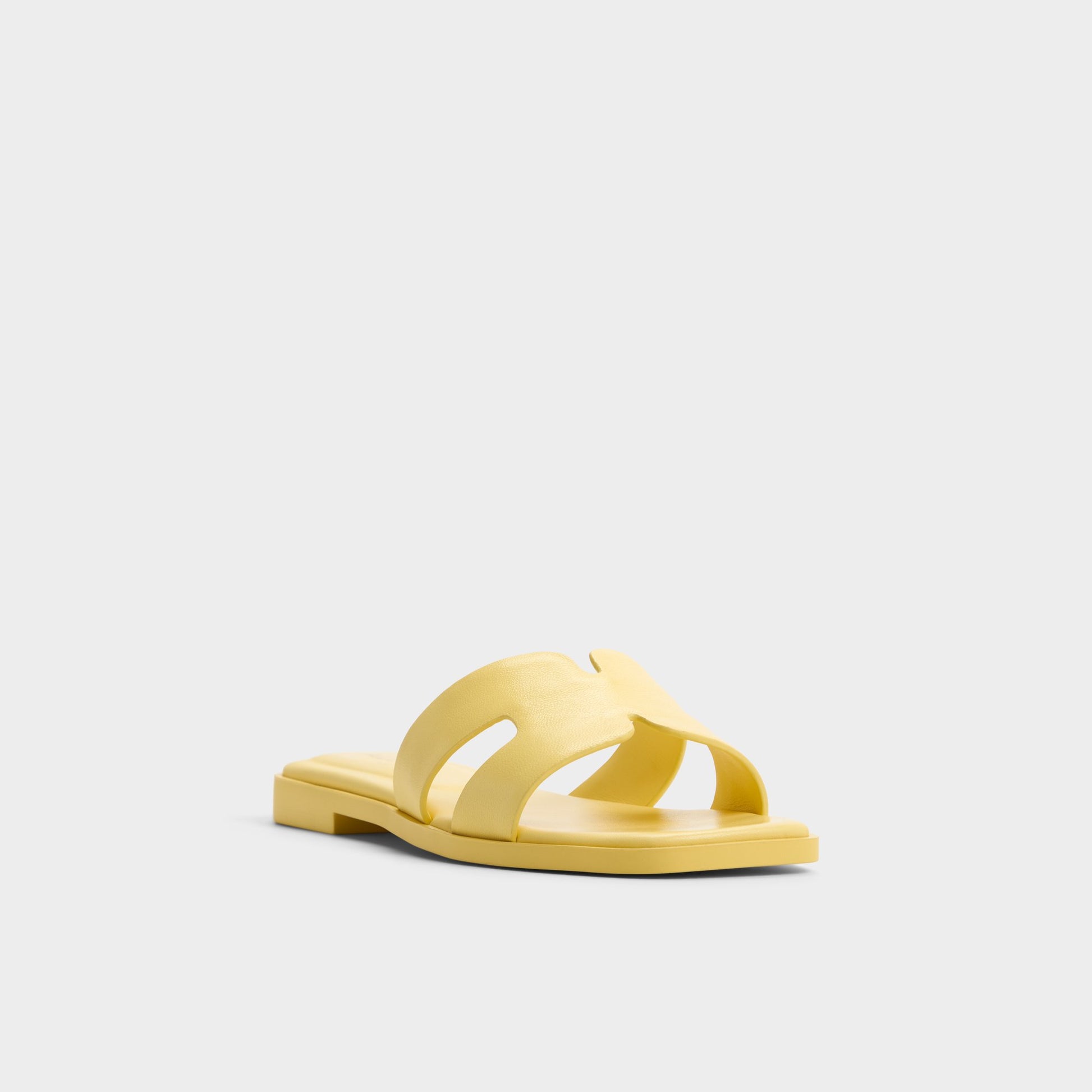 Three-quarter angle of Yellow Itsandal Slide sandal's front side