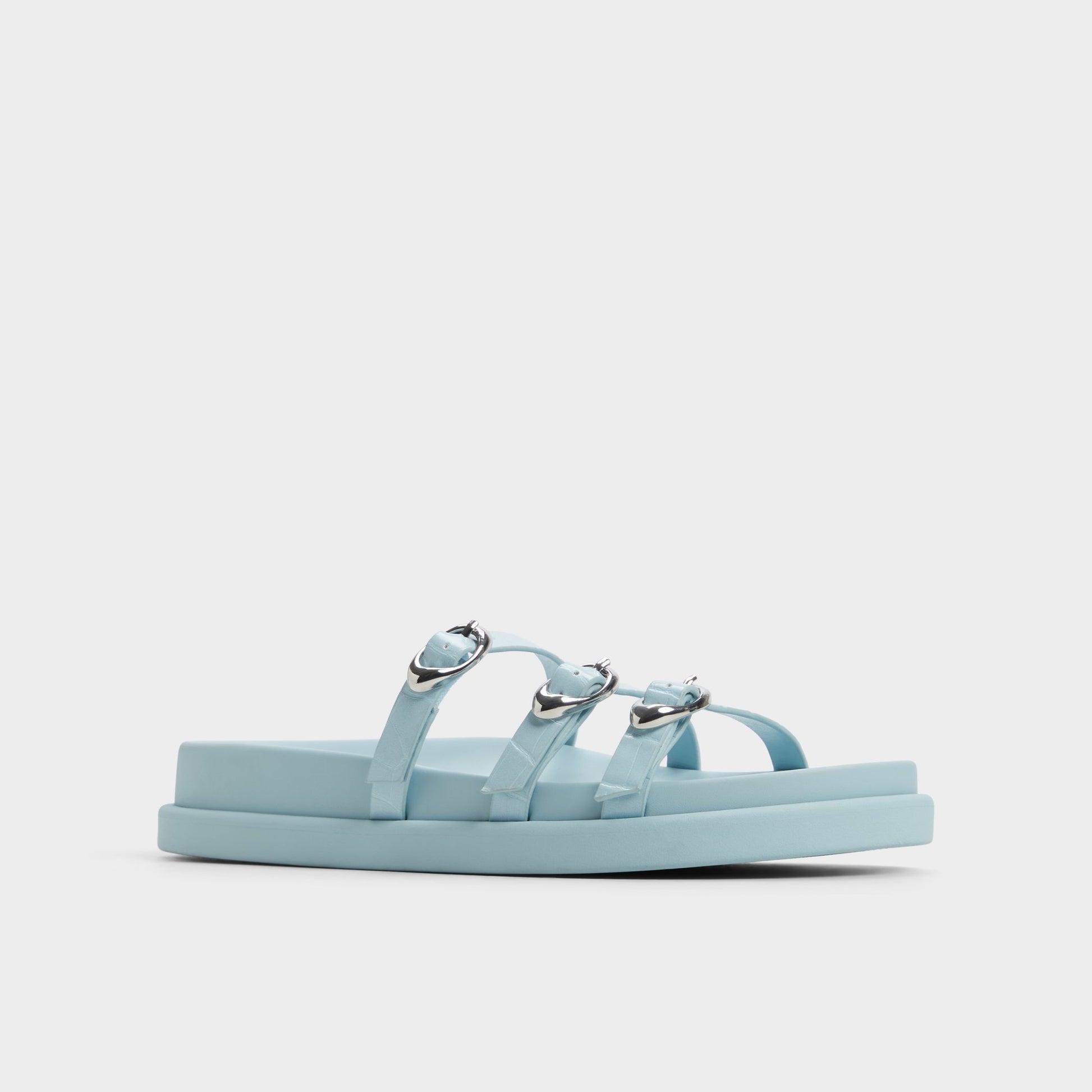 Three-quarter angle of Pastel Blue Zephyra Footbed sandal's front side