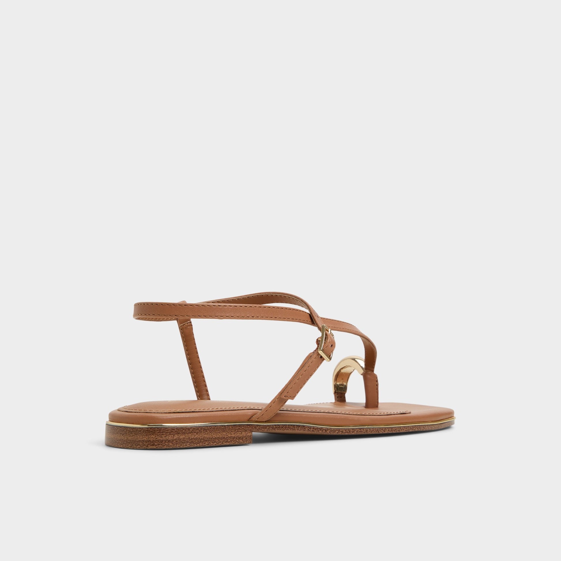 Three-quarter angle of Medium Brown Jomalina Strappy flat sandal's back side