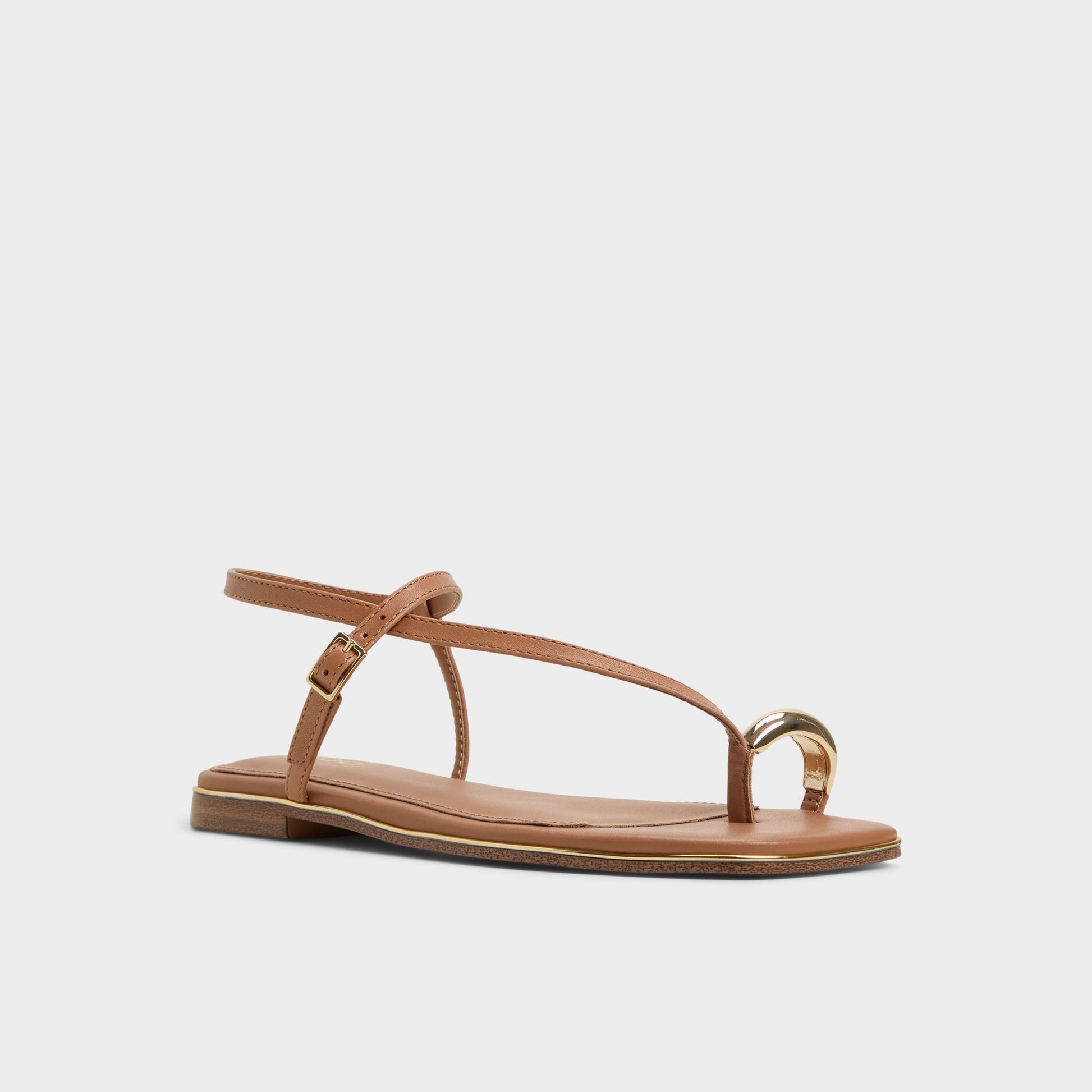 Three-quarter angle of Medium Brown Jomalina Strappy flat sandal's front side
