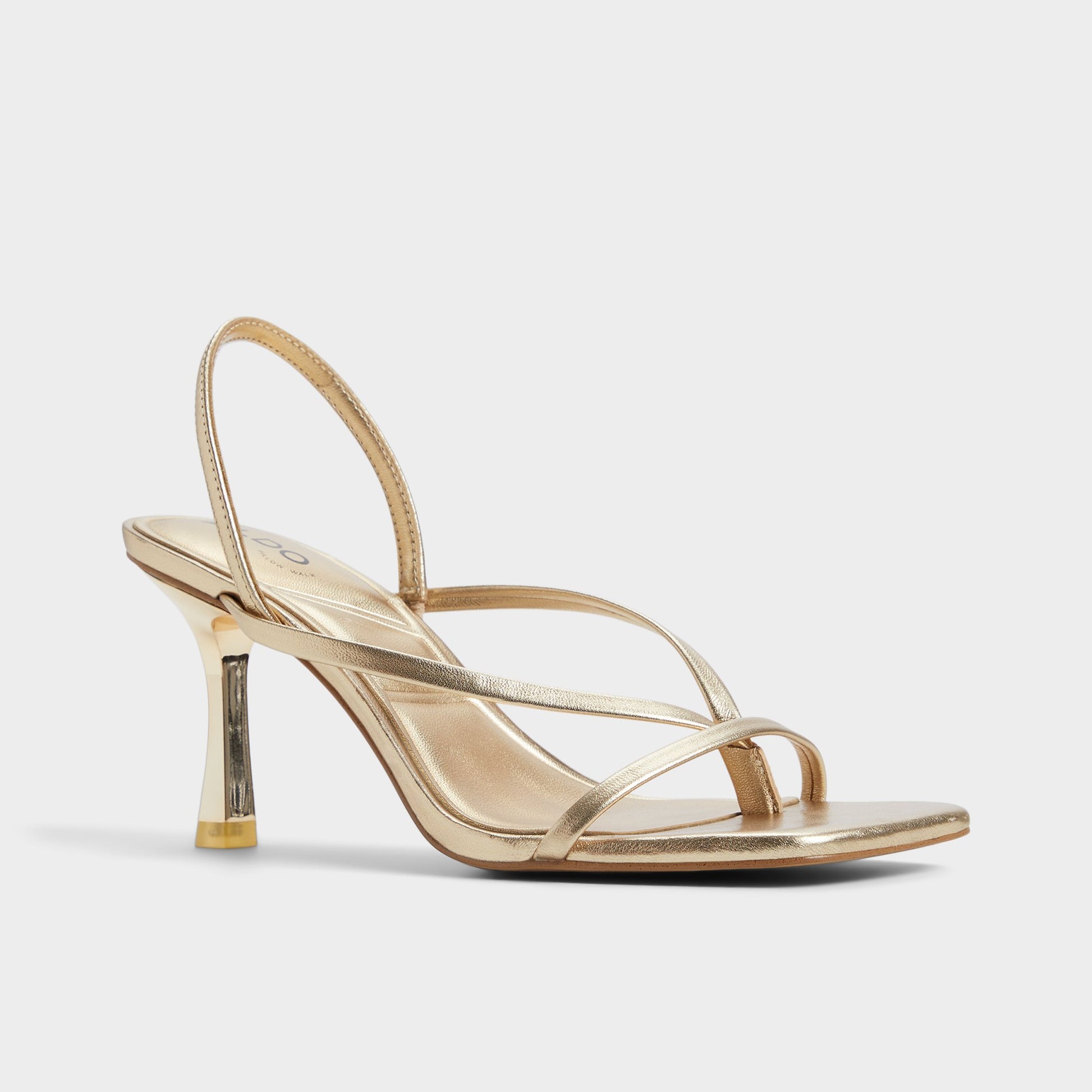 Three-quarter angle of Gold Riva Sling back heeled sandal's front side