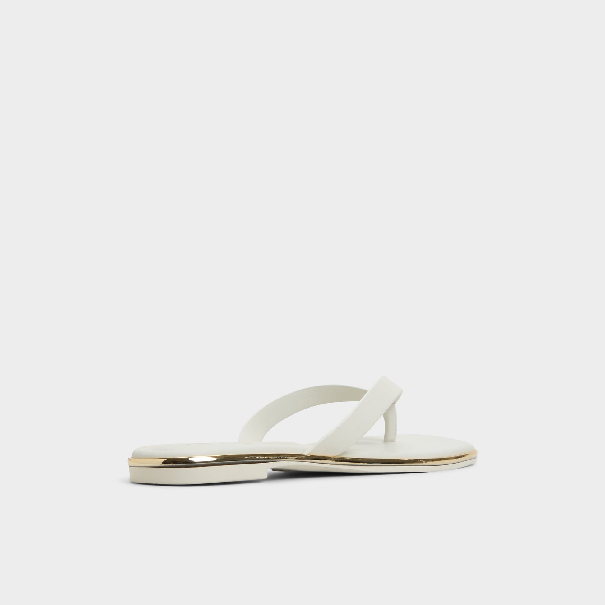 Three-quarter angle of White/Bone Theao Flip flop's back side