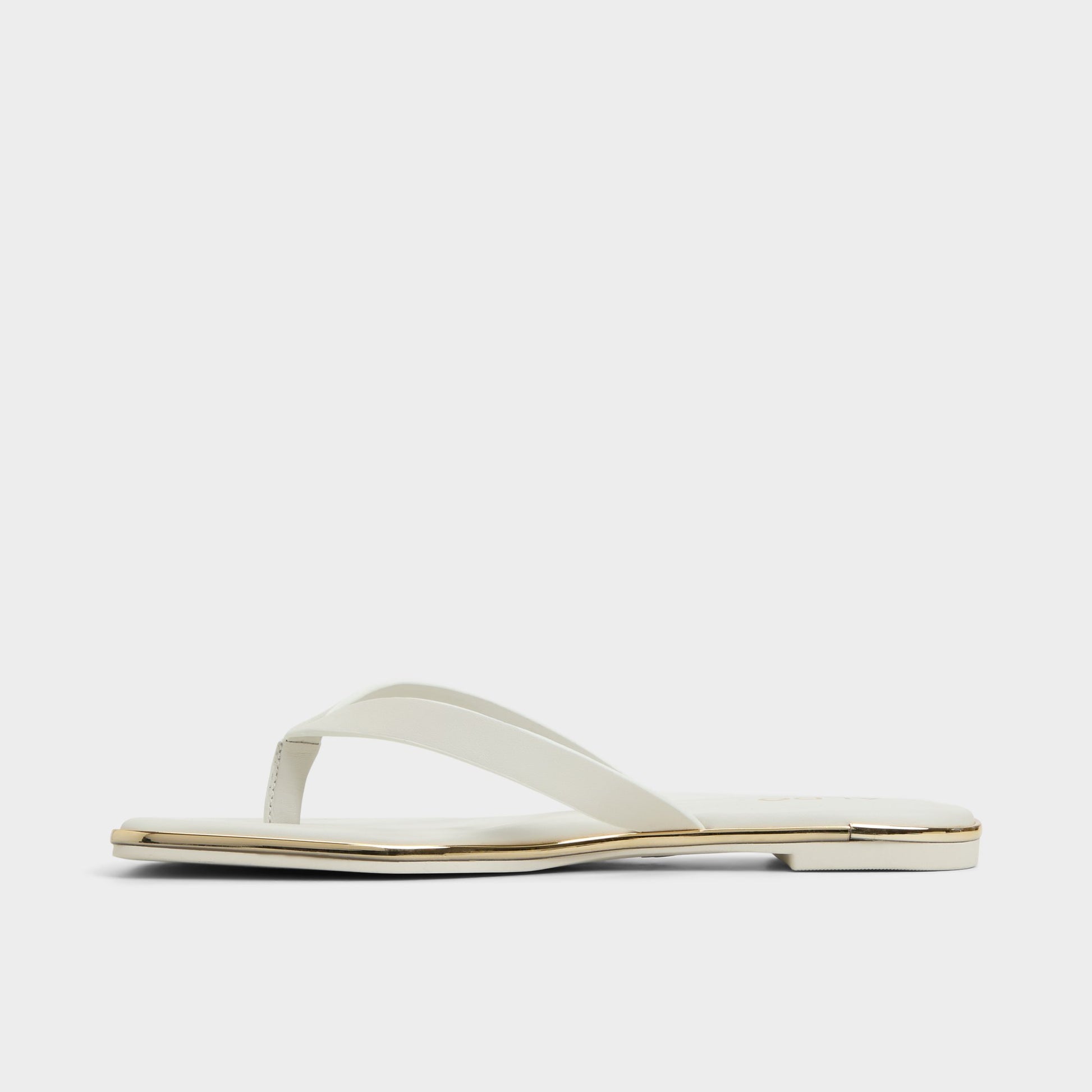 Side view of White/Bone Theao Flip flop