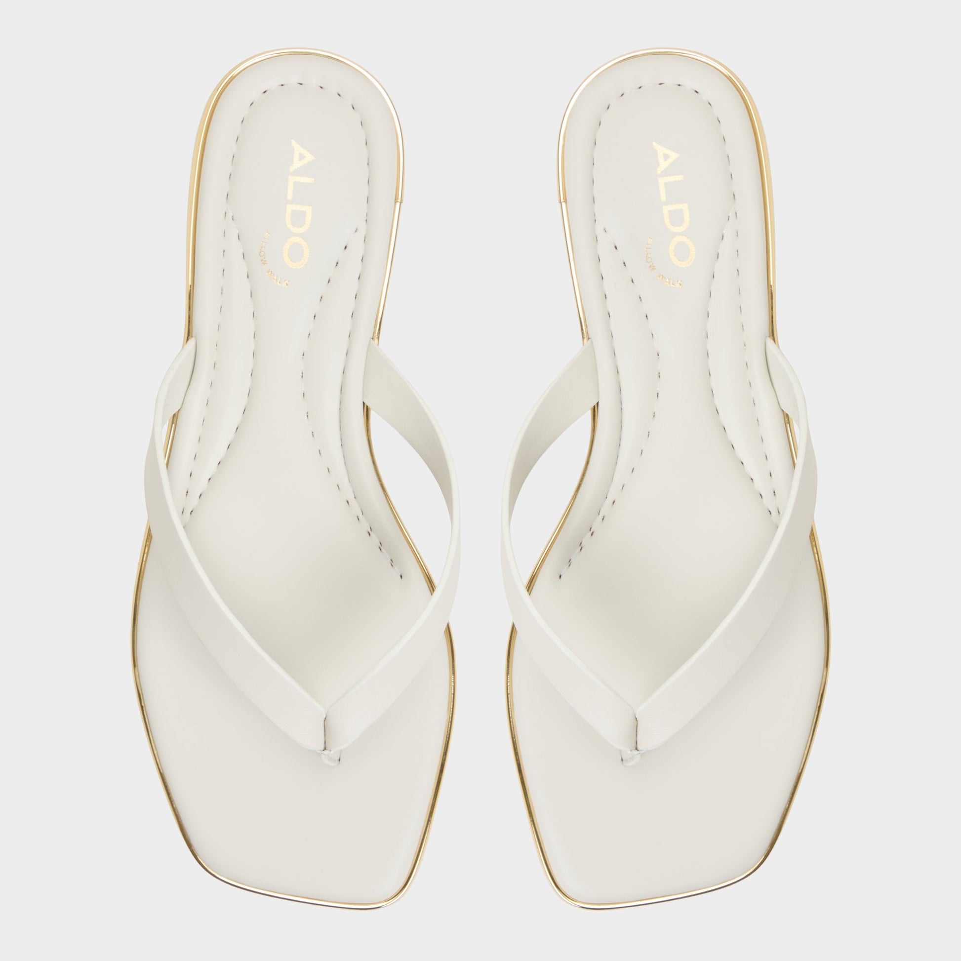Top-down view of the White/Bone Theao Flip flop