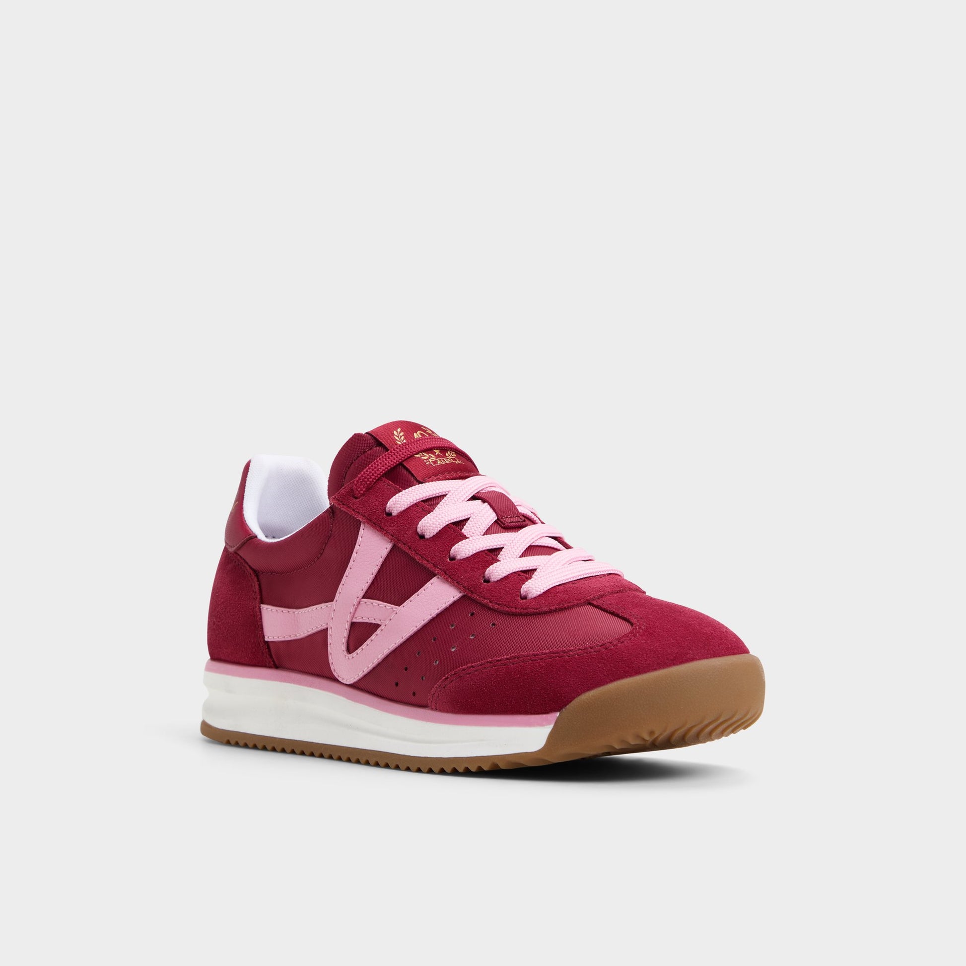 Three-quarter angle of Dark Pink Stepcount Jogger sneaker's front side