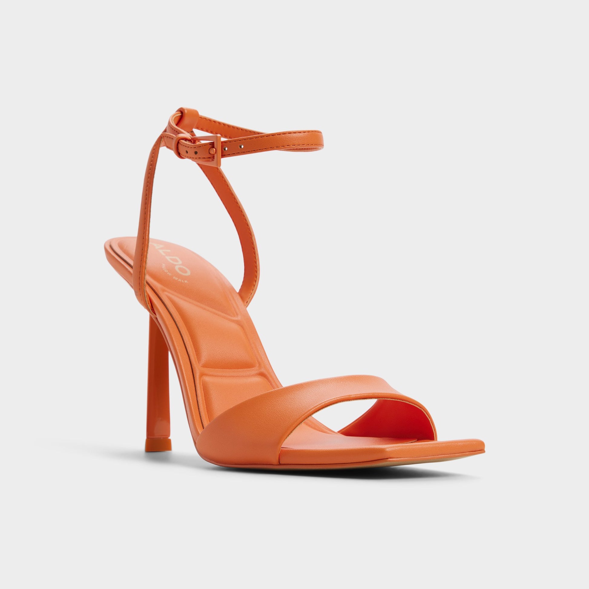 Three-quarter angle of Medium Orange Illustrious Strappy heeled sandal's front side