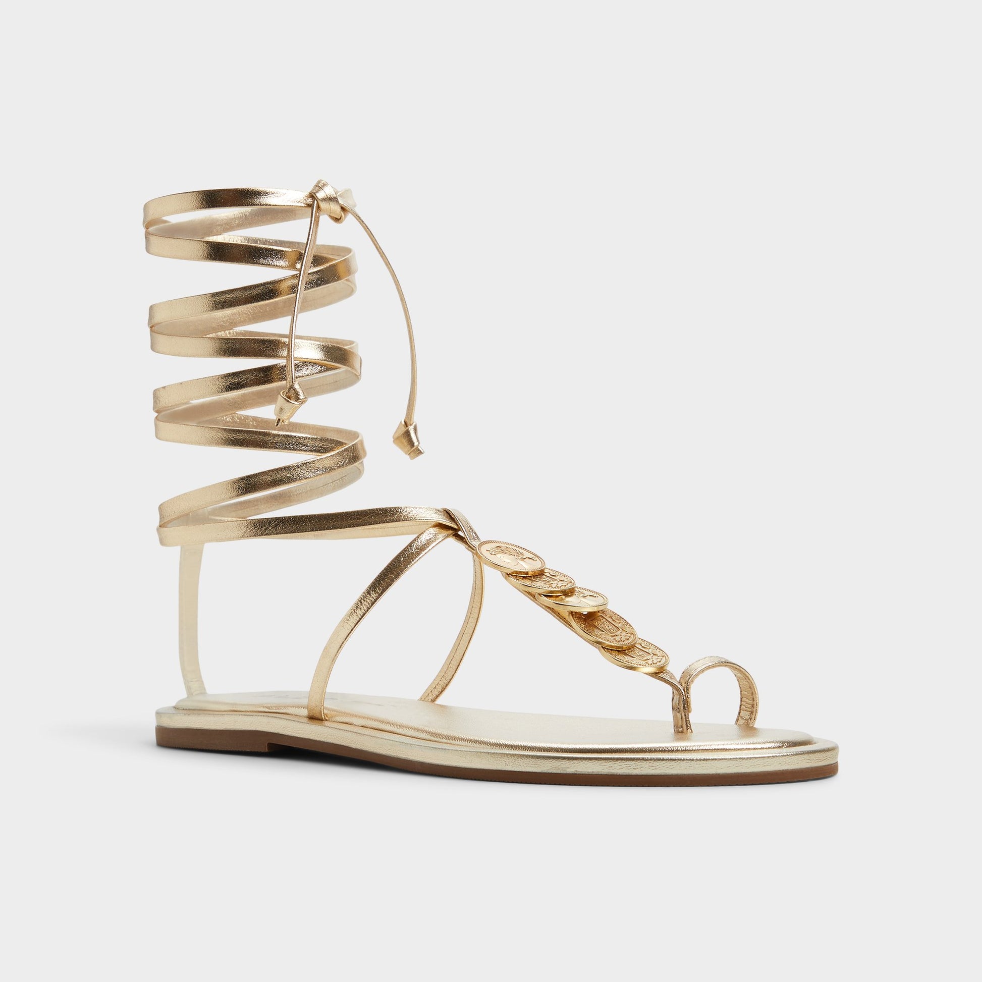 Three-quarter angle of Gold Artemisa T-strap sandal's front side