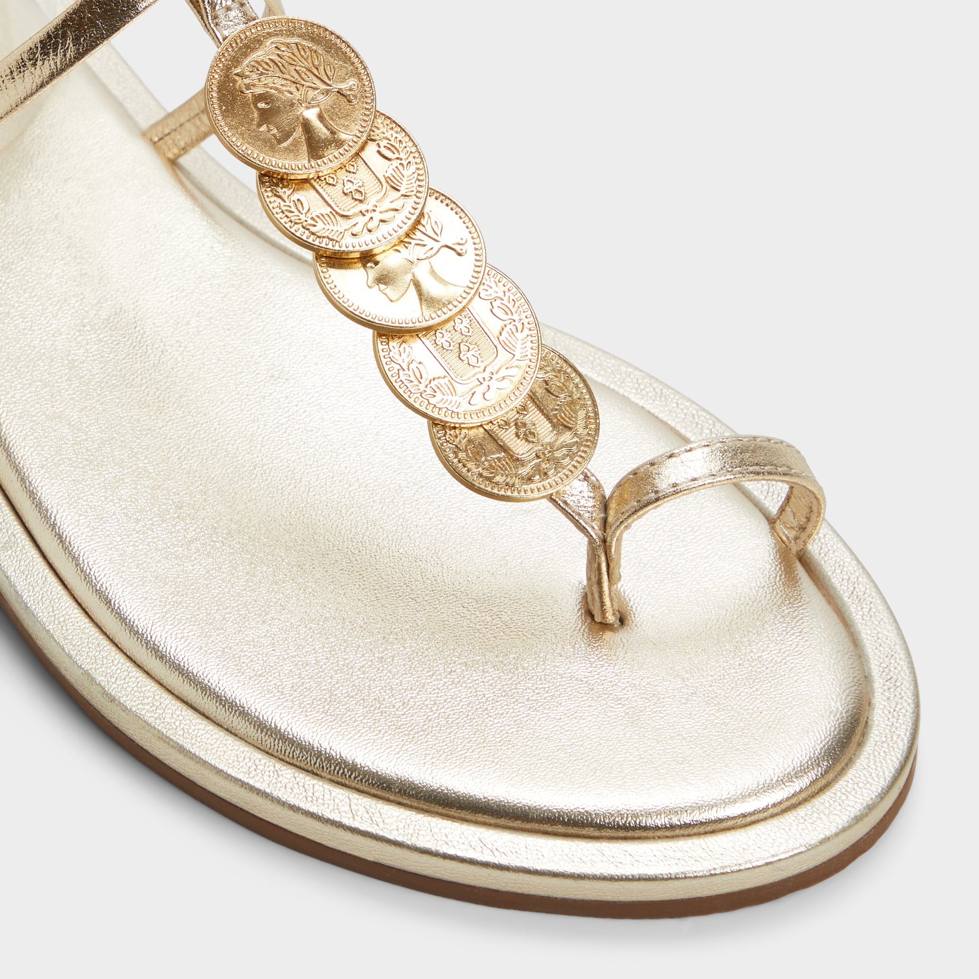 Close-up of the Gold Artemisa T-strap sandal