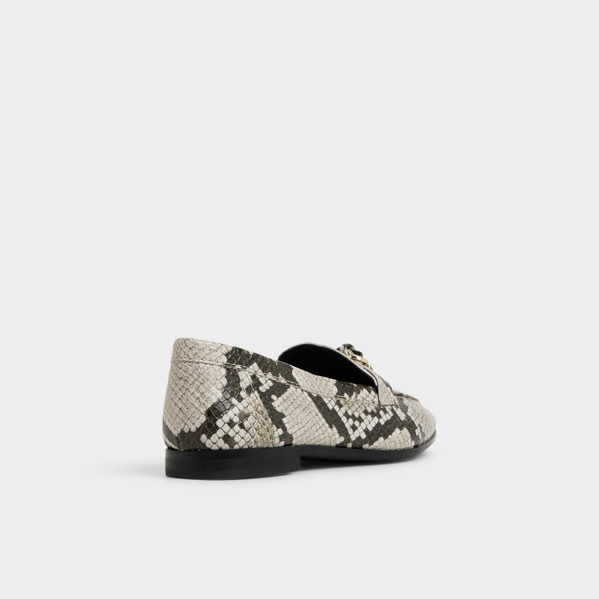 Three-quarter angle of White/Black Ybilide Loafer's back side