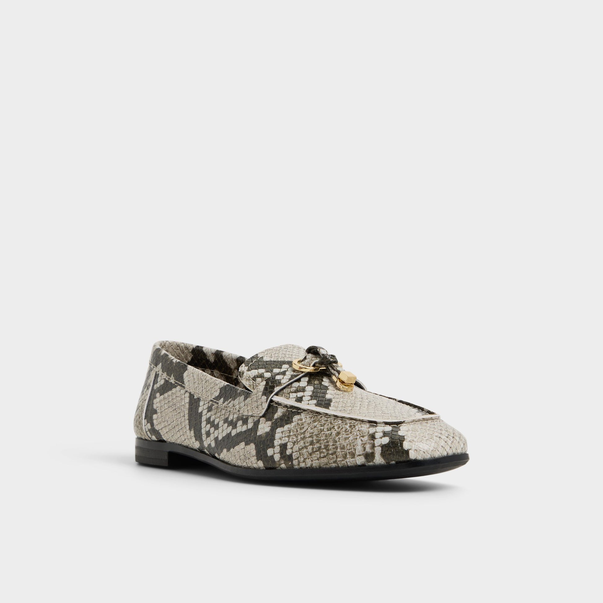 Three-quarter angle of White/Black Ybilide Loafer's front side