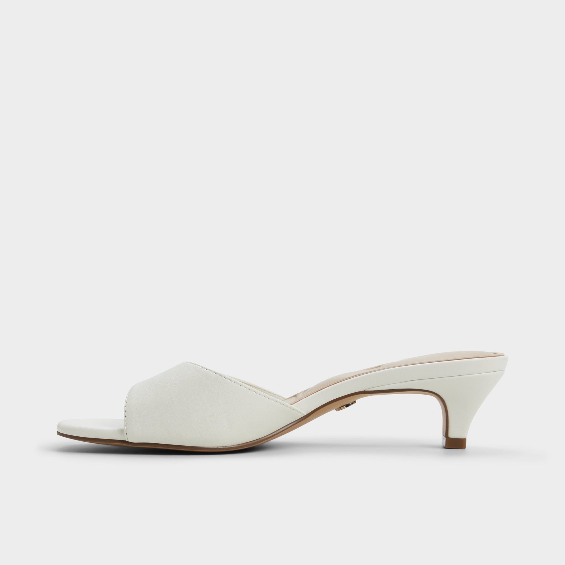Side view of White Haeden Heeled mule