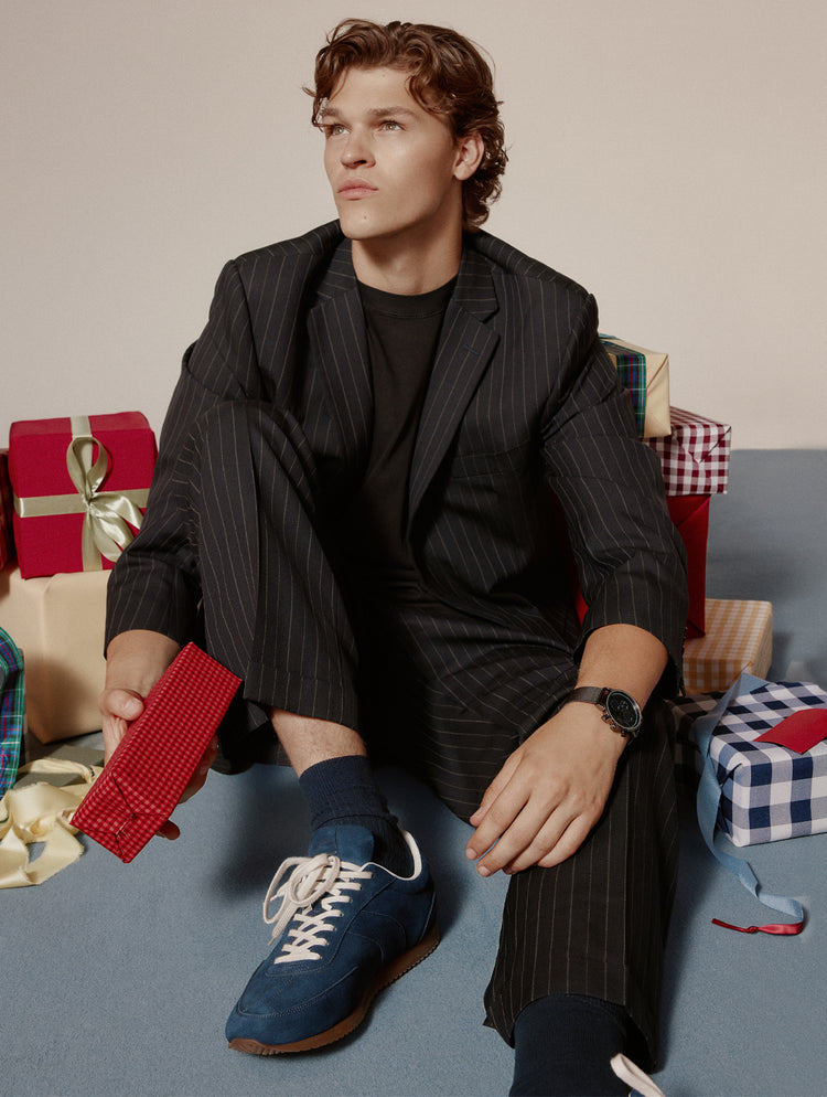 Man wearing blue suede sneakers