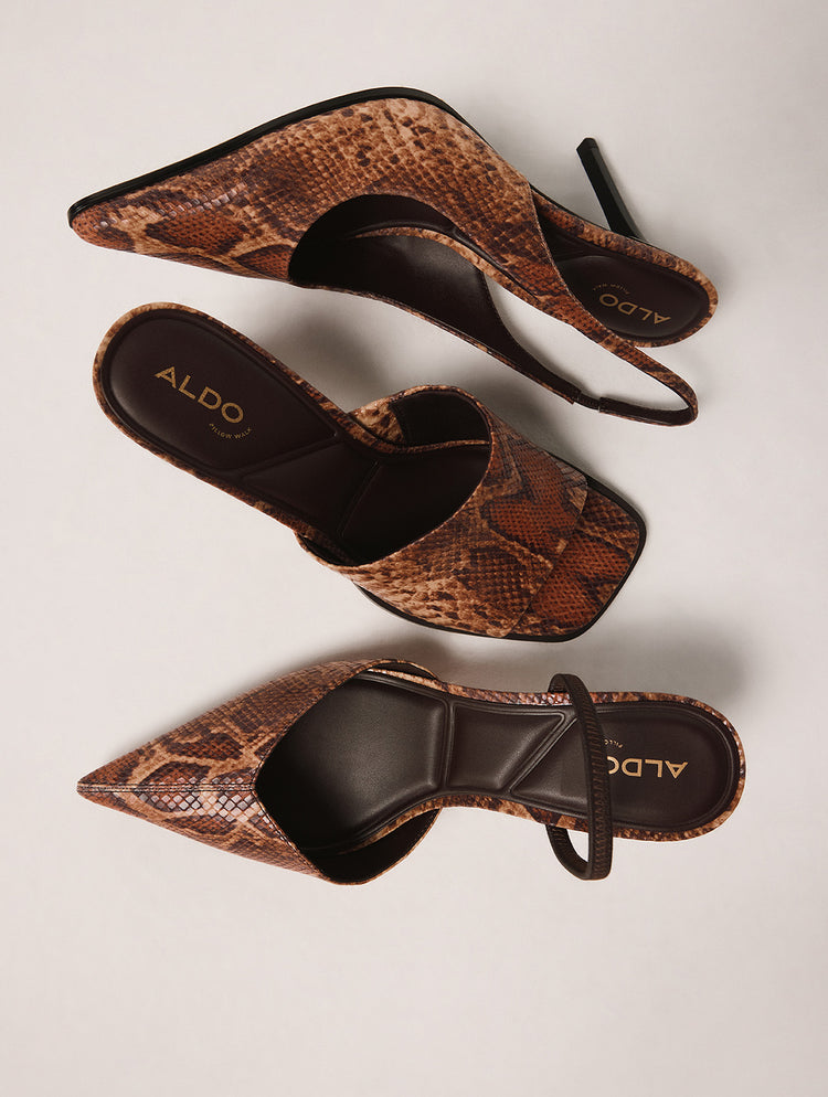 Brown snake print heels with 'ALDO' branding on a light gray background