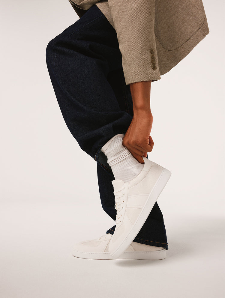 Men's white sneakers.