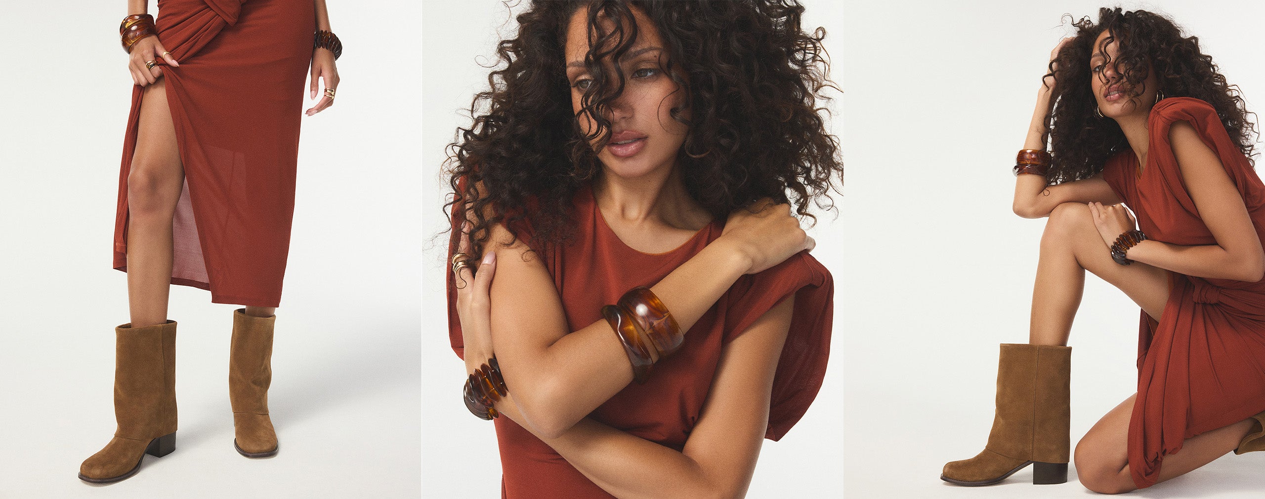 Woman in a red dress and brown boots posing against a white background.