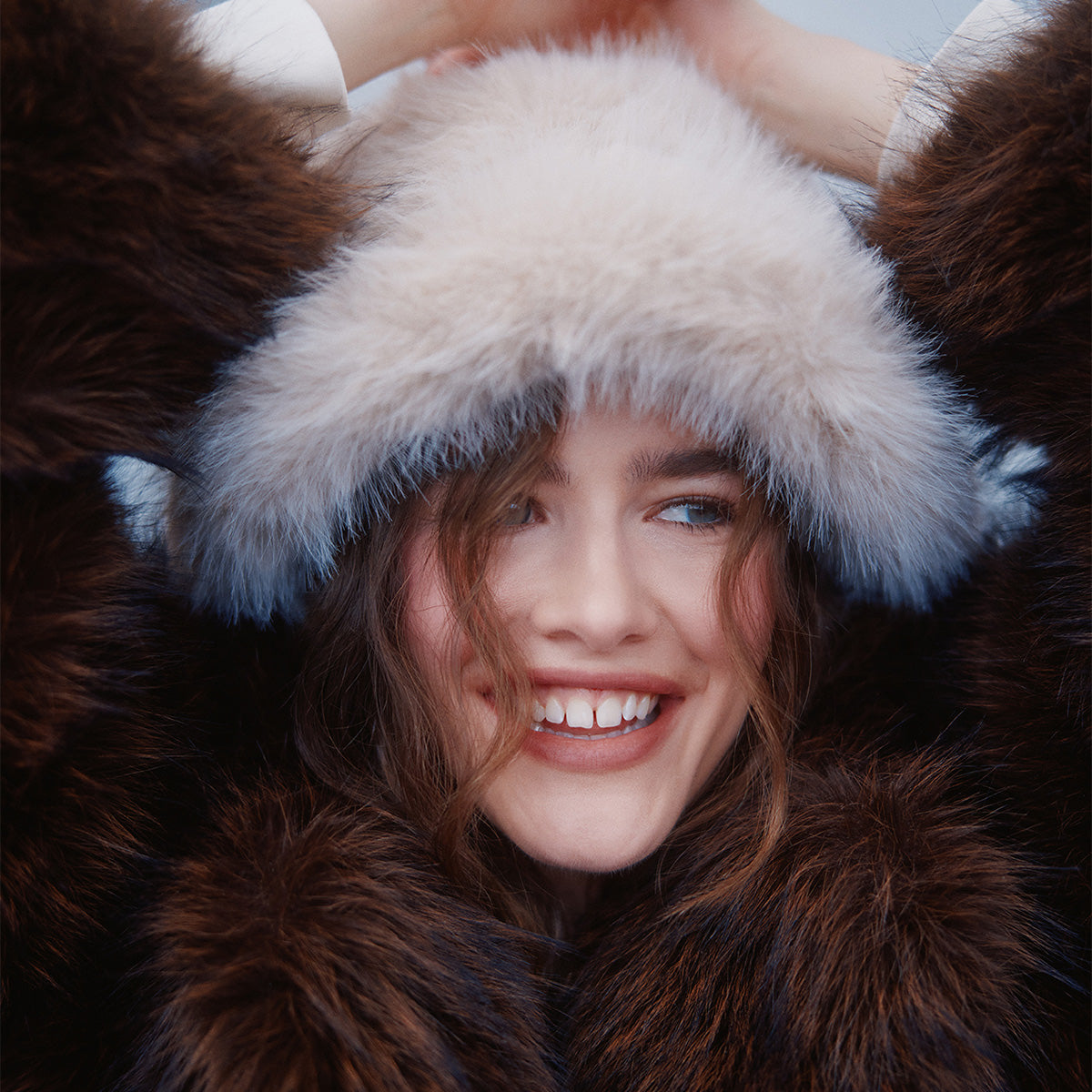 Woman wearing a fur coat and furry hat