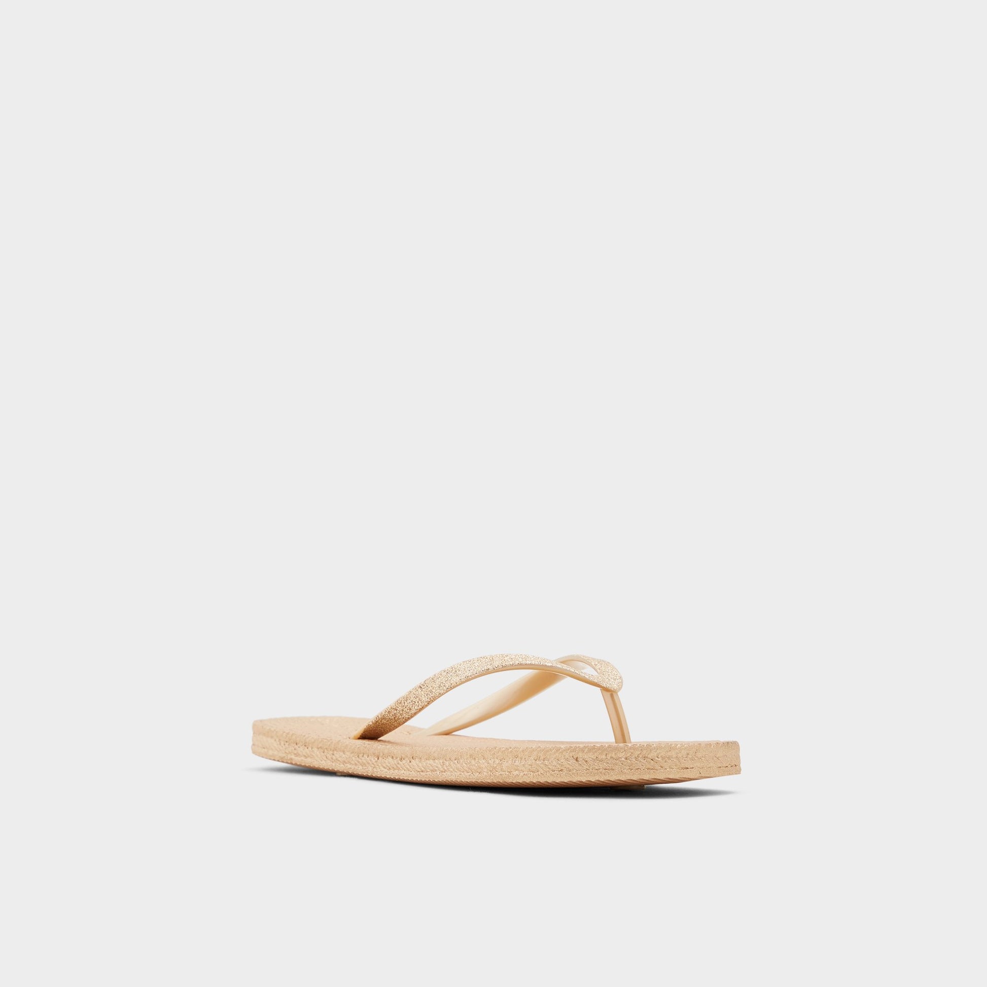 Three-quarter angle of Gold Aloomba Flip flop's front side
