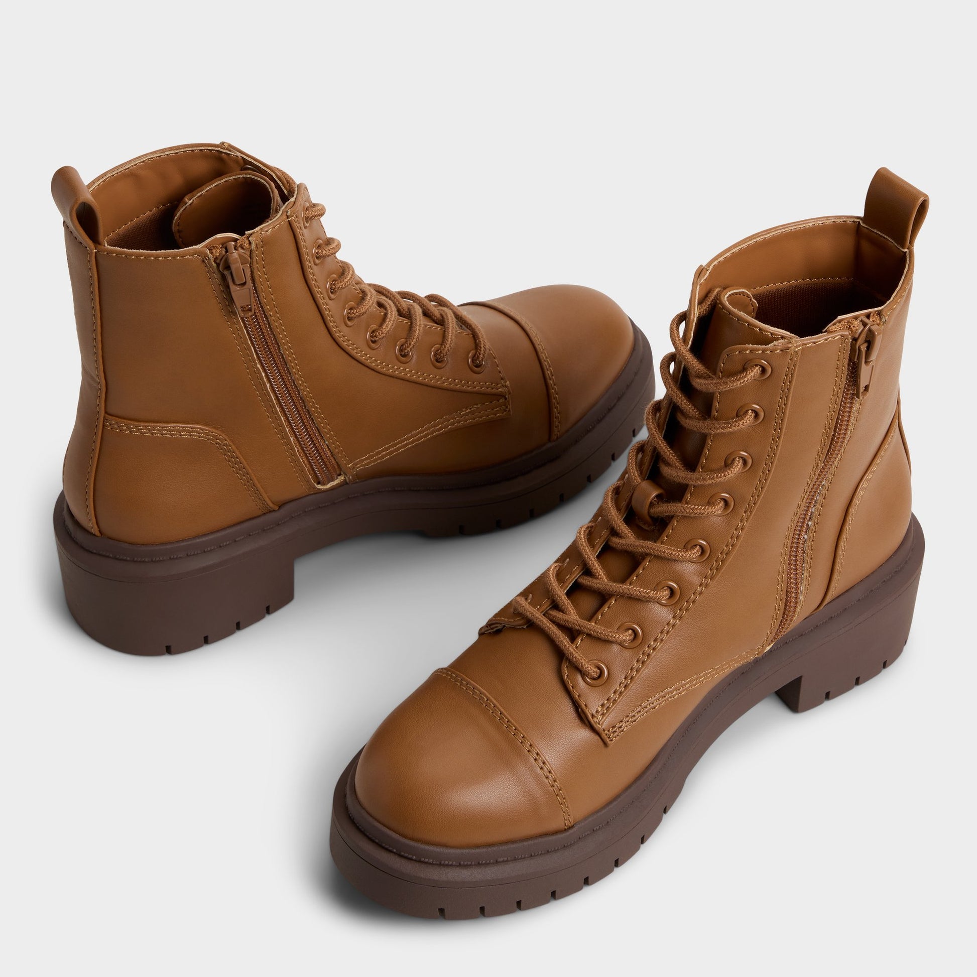 Highlighted view of a pair of Cognac Goer Combat ankle boots