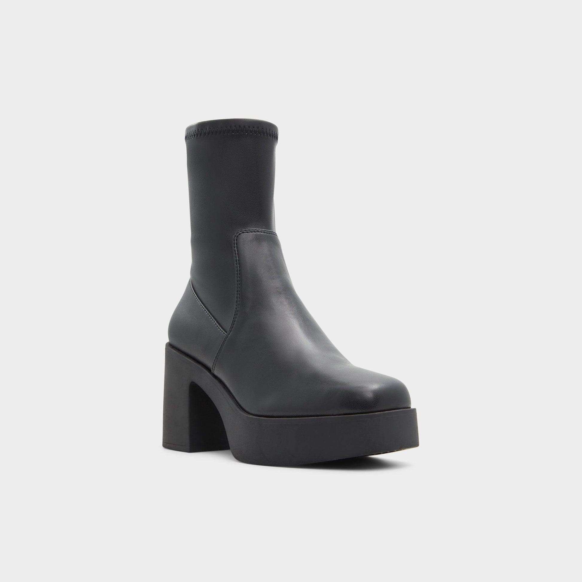 Three-quarter angle of Black Upstep Ankle boot's front side