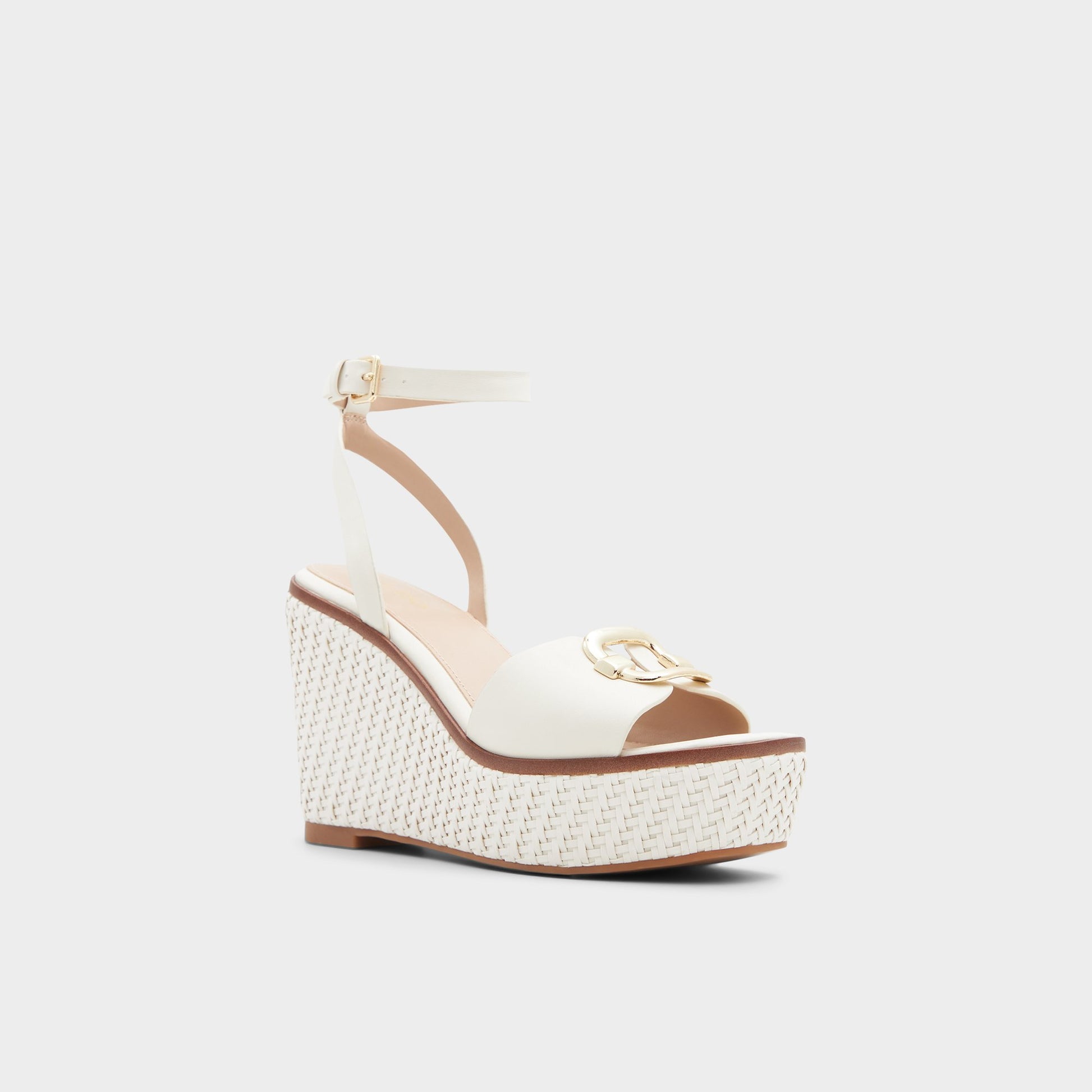 Three-quarter angle of Open White Carrabriria Wedge sandal's front side