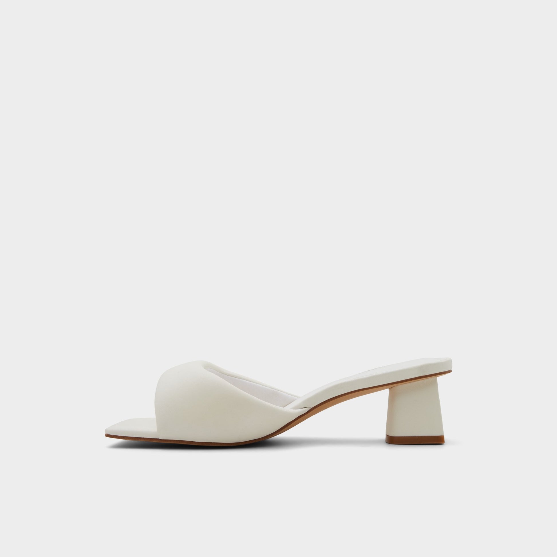 Side view of White Aneka Heeled mule