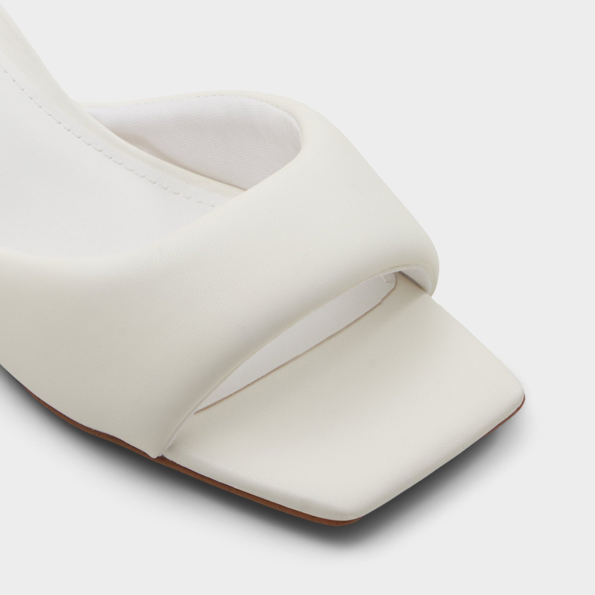 Close-up of the White Aneka Heeled mule