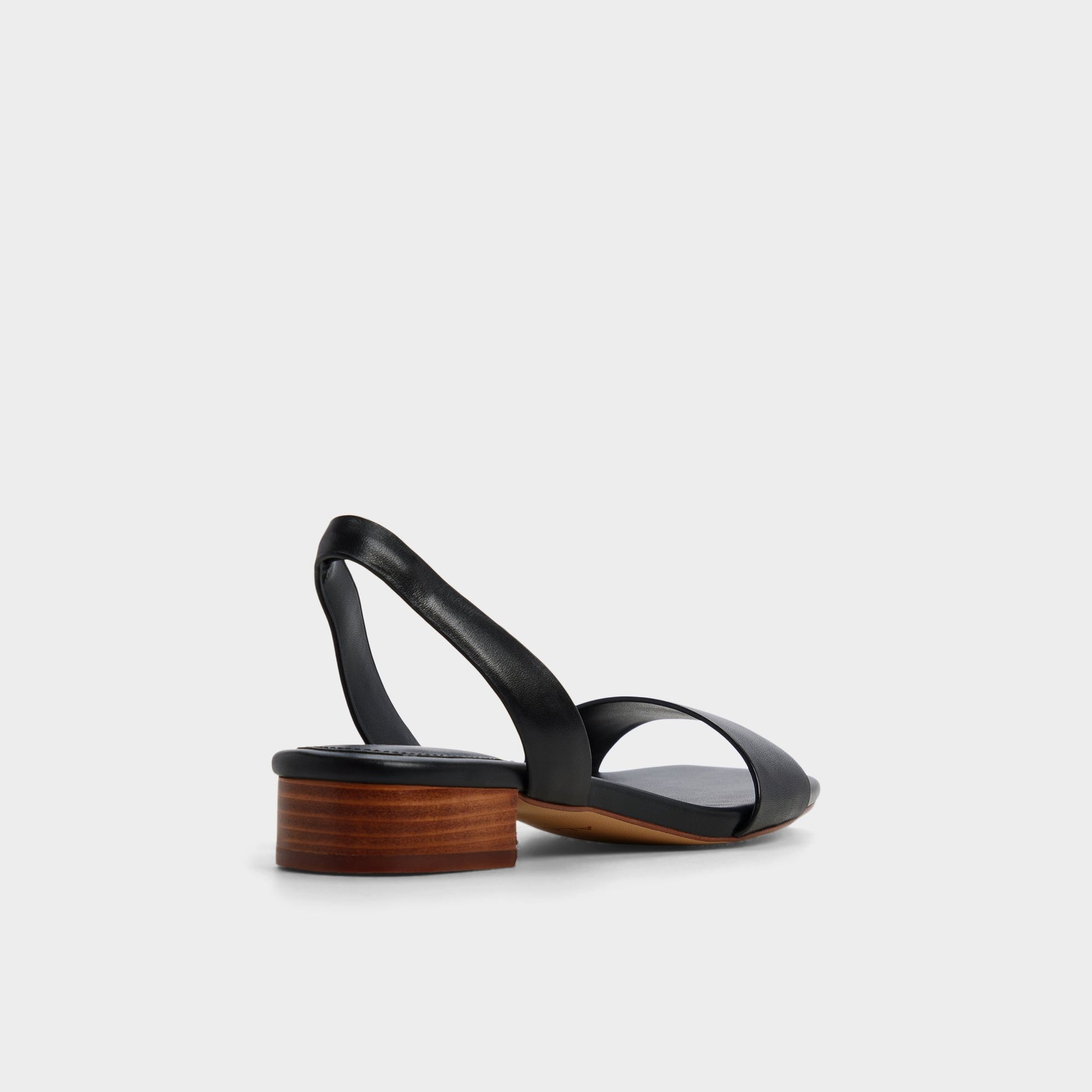 Three-quarter angle of Black Dorenna Black strappy sandal's back side