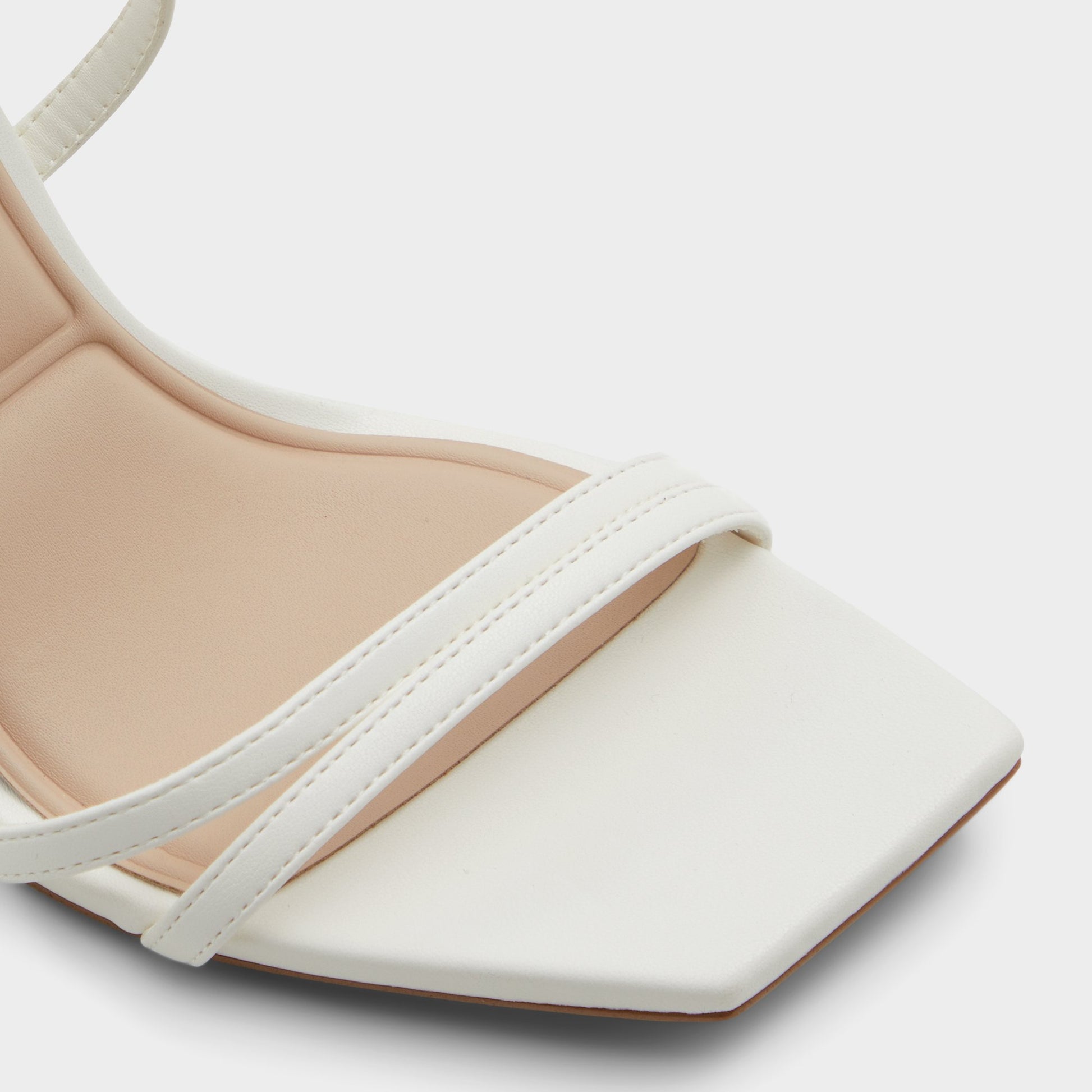Close-up of the White Phaedra Strappy stiletto sandal
