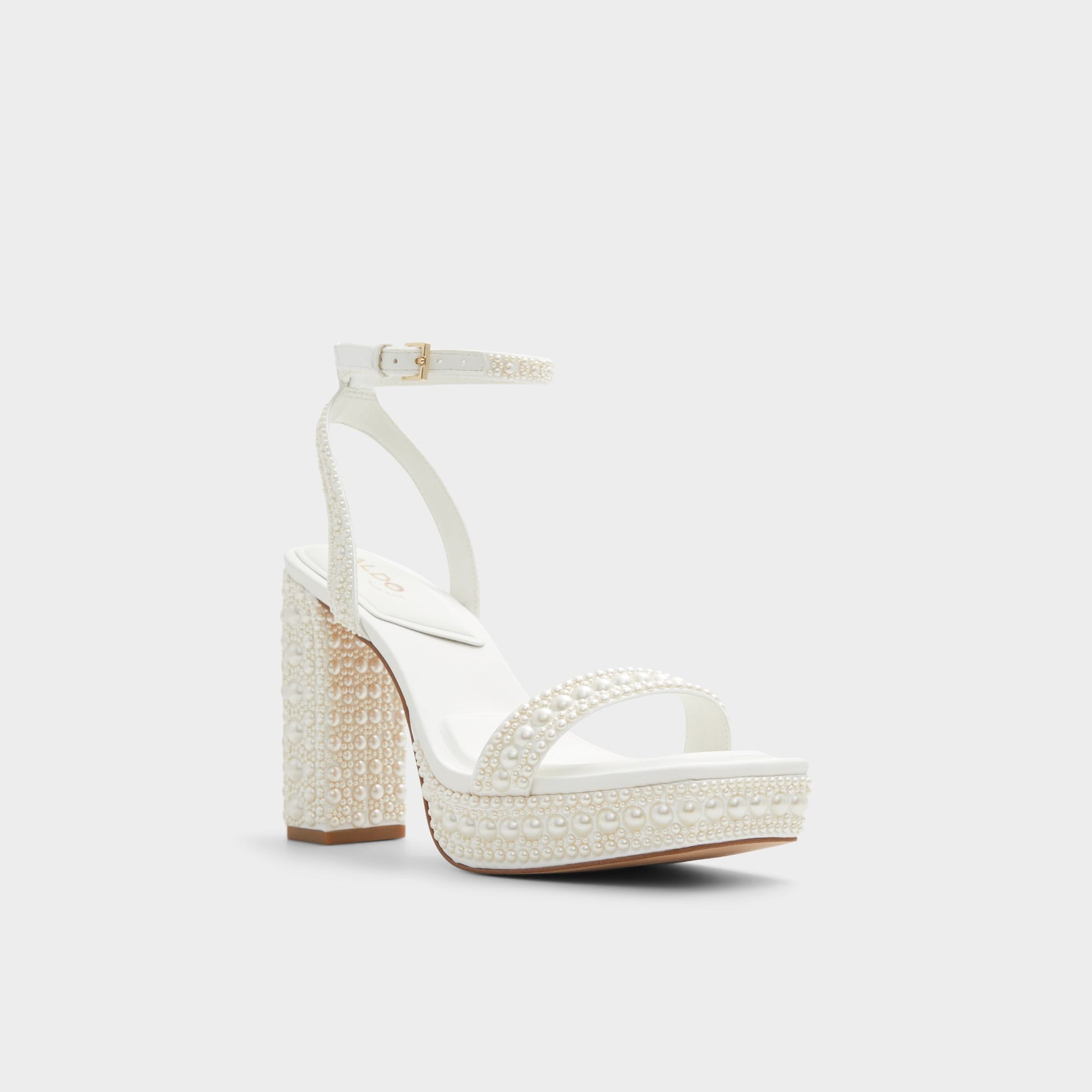 Three-quarter angle of White Lulu Strappy heeled sandal's front side
