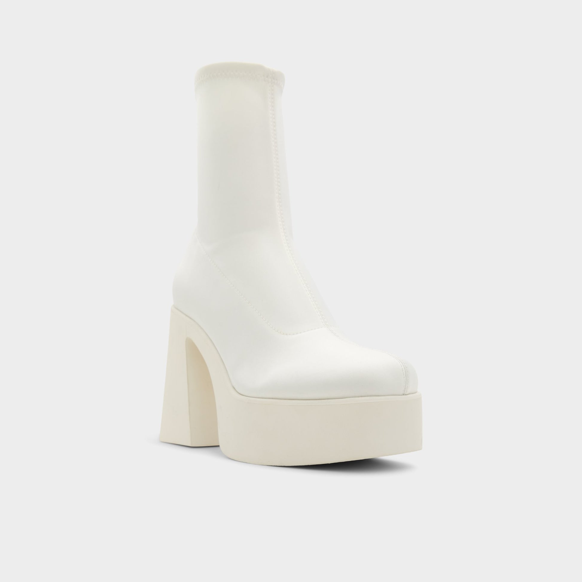 Three-quarter angle of White/Bone Grandstep Ankle boot's front side