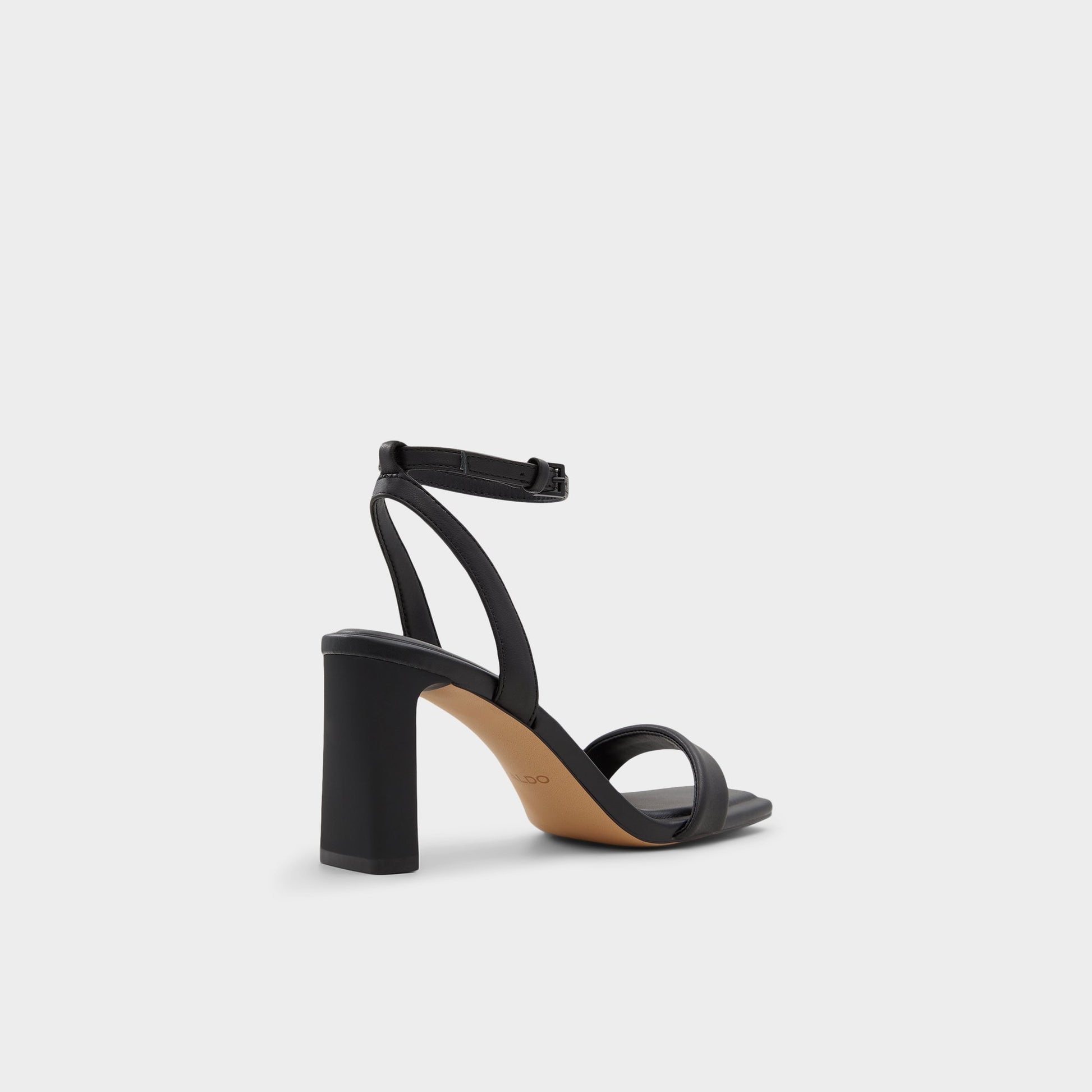 Three-quarter angle of Black Aurorai Strappy heeled sandal's back side
