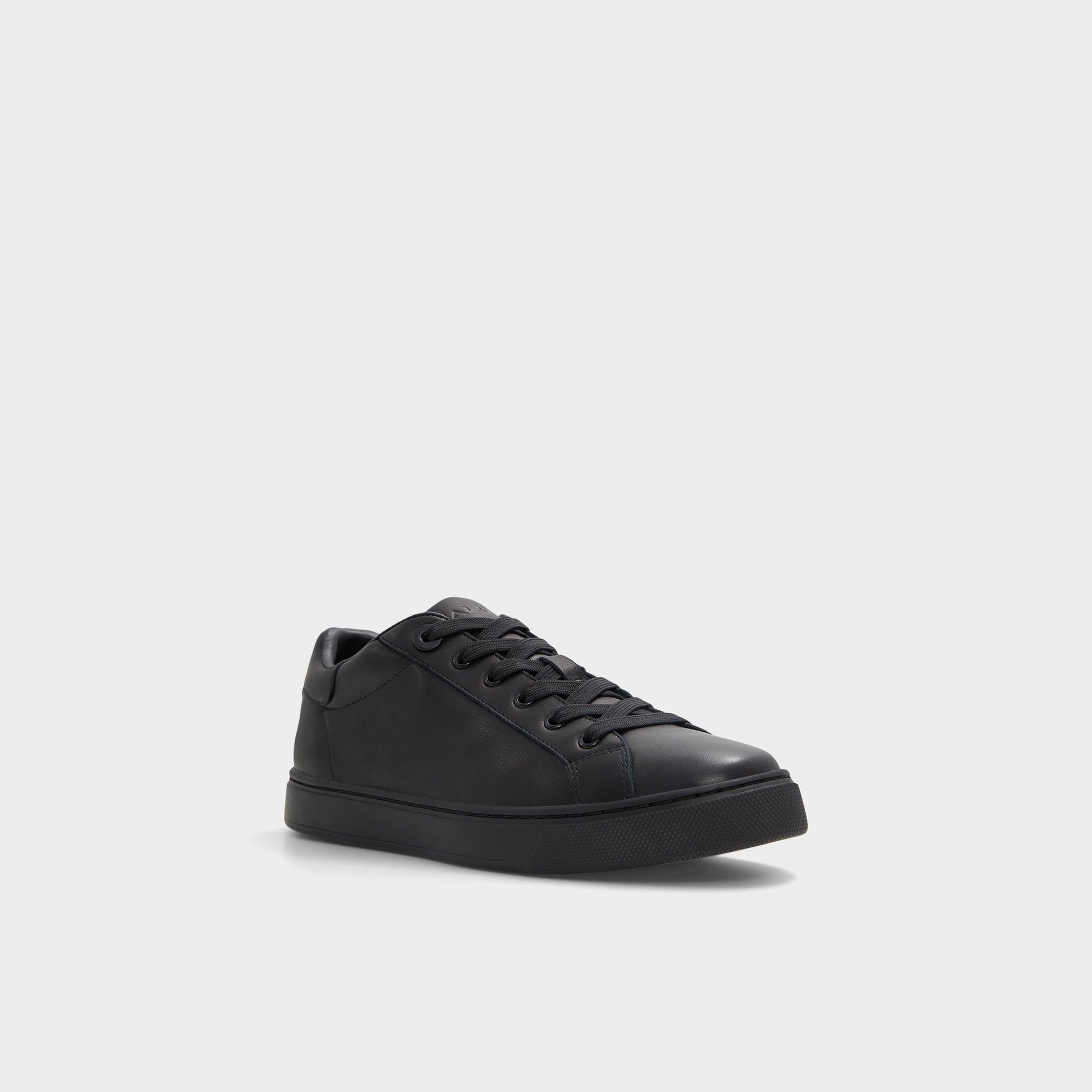 Angle de trois quarts de la face avant de Noir/Noir Woolly Sneaker bas